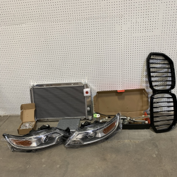 LOT OF 7 - USED MIXED AUTOMOTIVE PARTS PALLET – HEADLIGHTS, RADIATORS, GRILLES & MORE - Total LOT MSRP $626