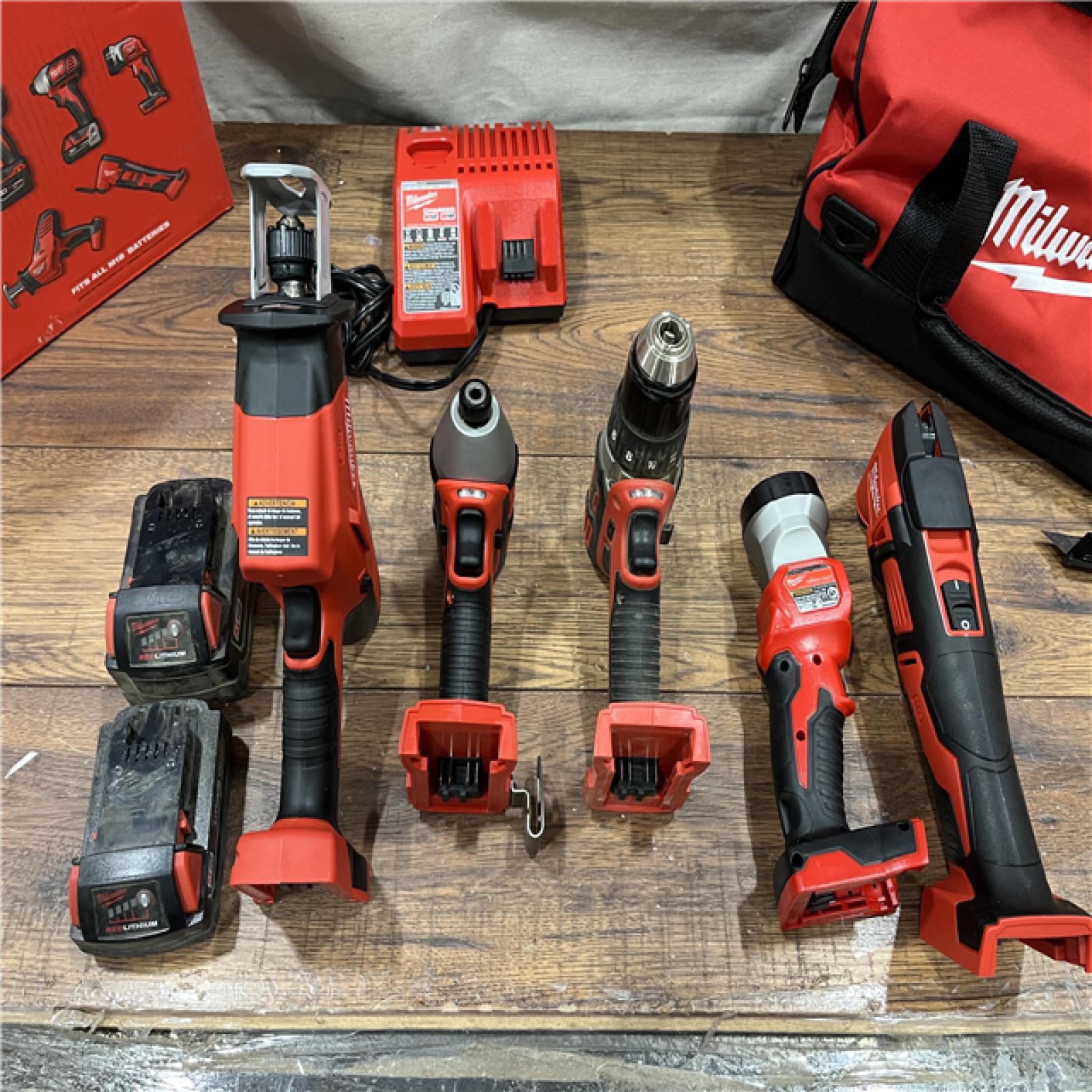 AS-IS Milwaukee M18 18V Lithium-Ion Cordless Combo Kit (5-Tool) with (2) Batteries, Charger and Tool Bag