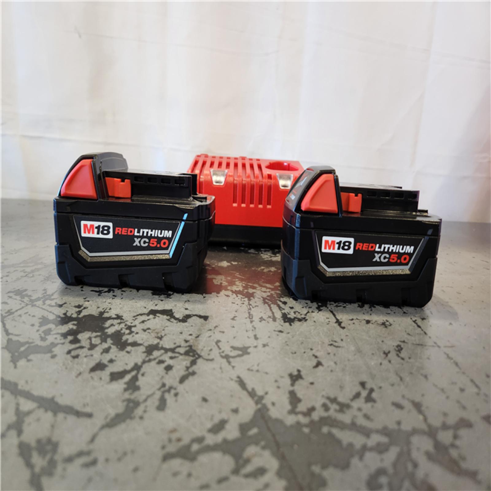 AS-IS- Milwaukee 18-Volt Lithium-Ion XC Starter Kit with Two 5.0Ah Batteries and Charger
