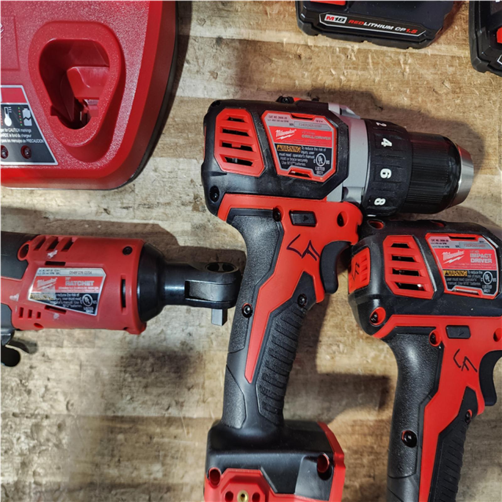 Houston Location AS-IS Milwaukee Drills QTY/2 and Electric Wrench Batteries QTY/2 and Chargers QTY/ 2
