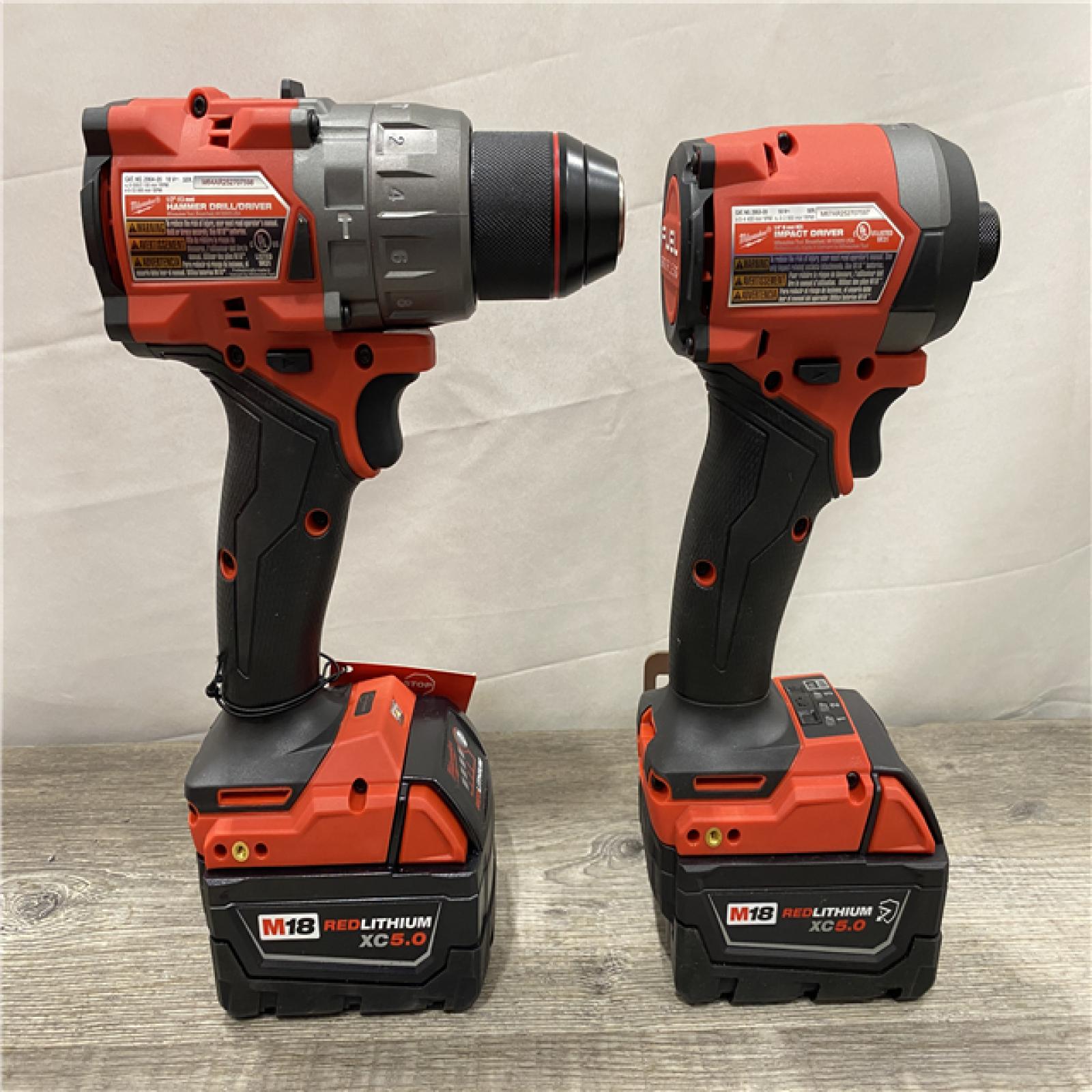 AS-IS Milwaukee FUEL 18V Lithium-Ion Brushless Cordless Hammer Drill and Impact Driver Combo Kit
