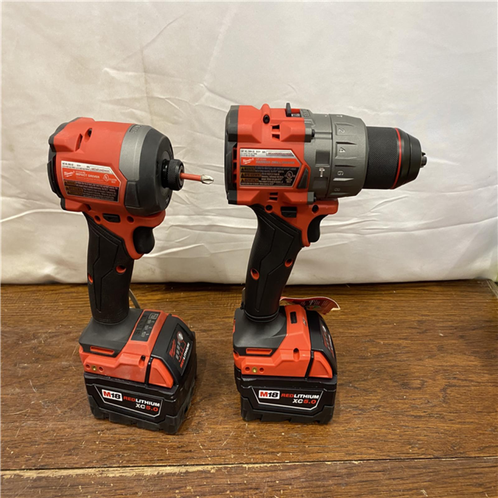 AS-IS MILWAUKEE M18 FUEL 18V Lithium-Ion Brushless Cordless Hammer Drill and Impact Driver Combo Kit (2-Tool) with 2 Batteries