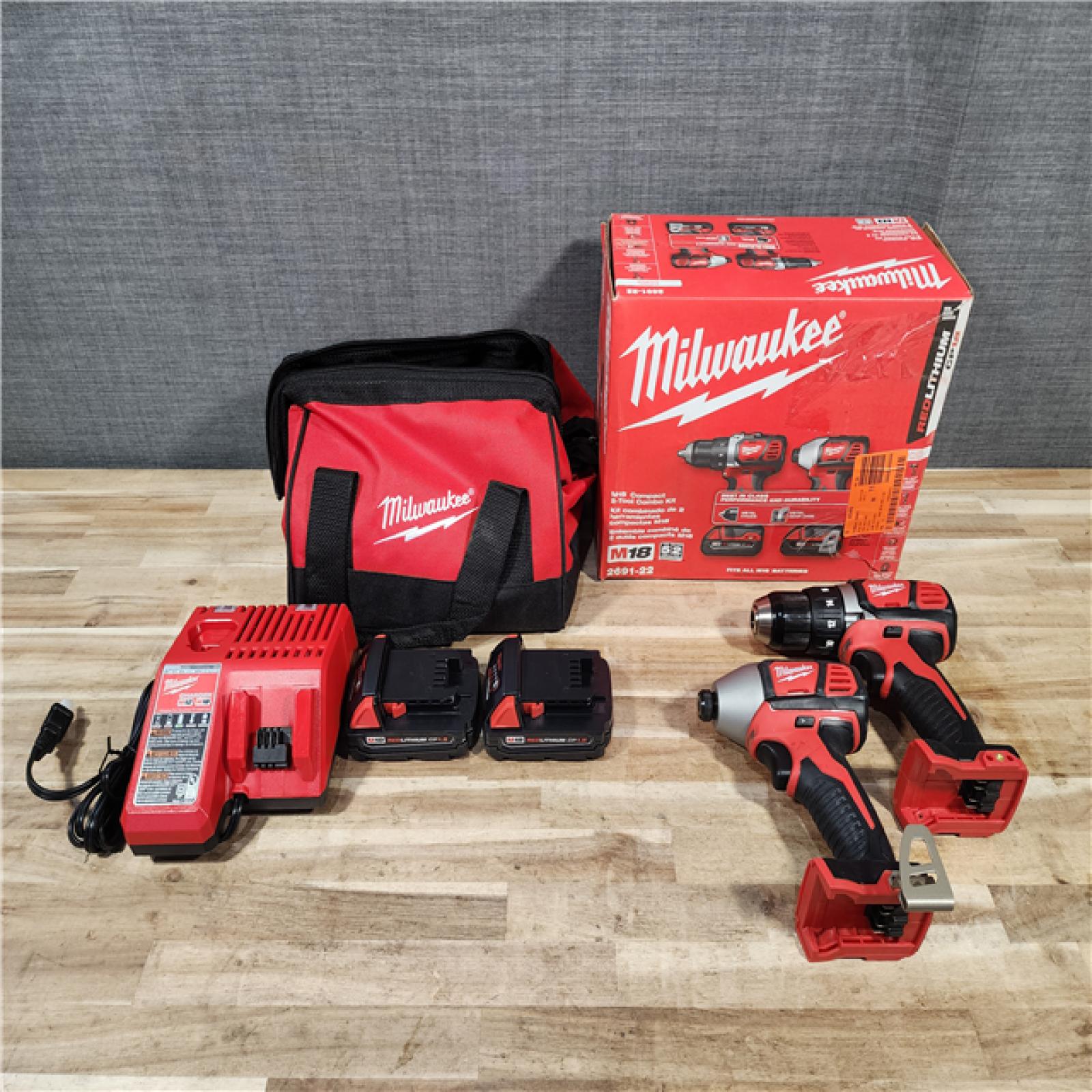 HOUSTON LOCATION - AS-IS Milwaukee M18 18V Lithium-Ion Cordless Drill Driver/Impact Driver Combo Kit