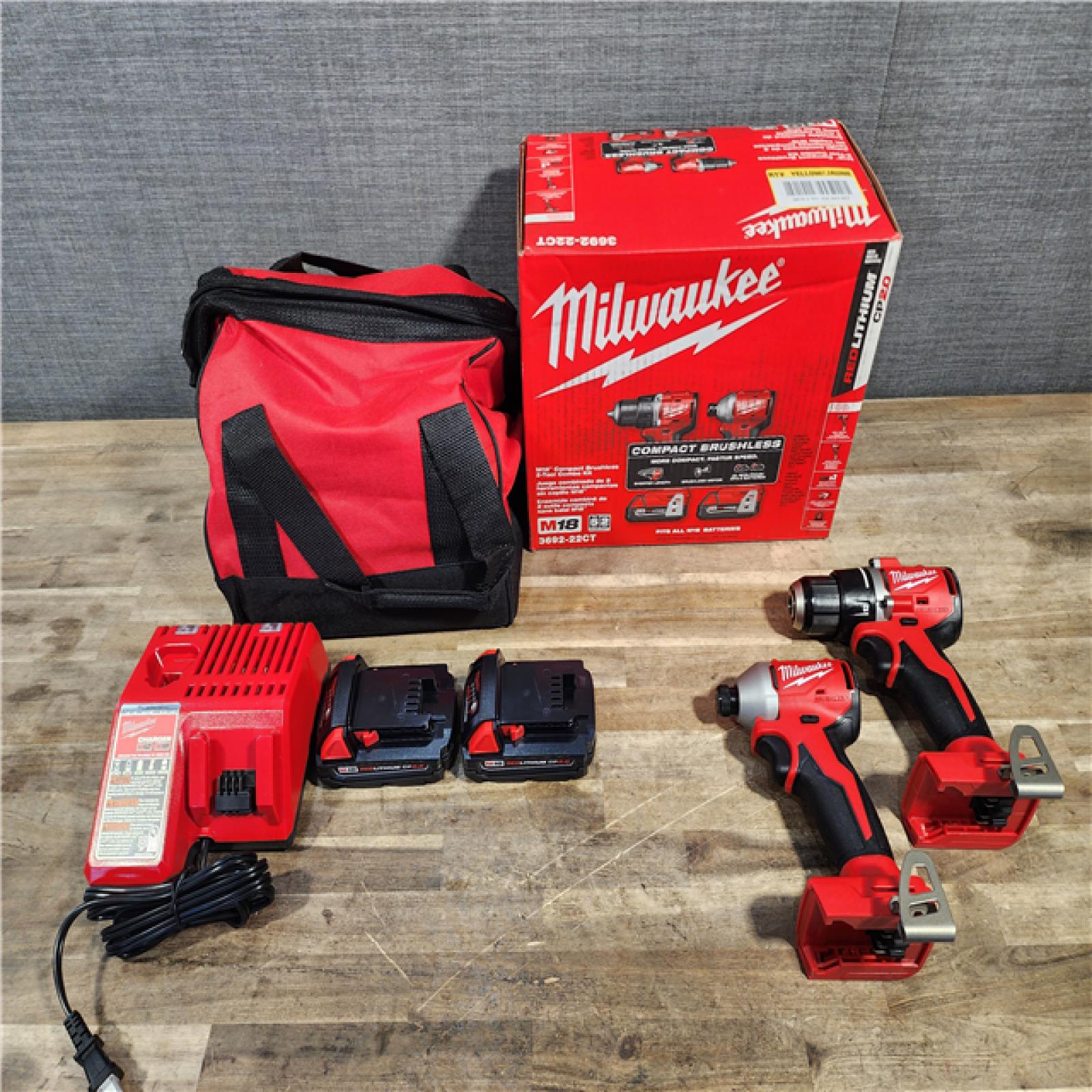 HOUSTON LOCATION - AS-IS Milwaukee M18 18V Lithium-Ion Brushless Cordless Compact Drill/Impact Combo Kit (2-Tool) W/(2) 2.0 Ah Batteries, Charger & Bag