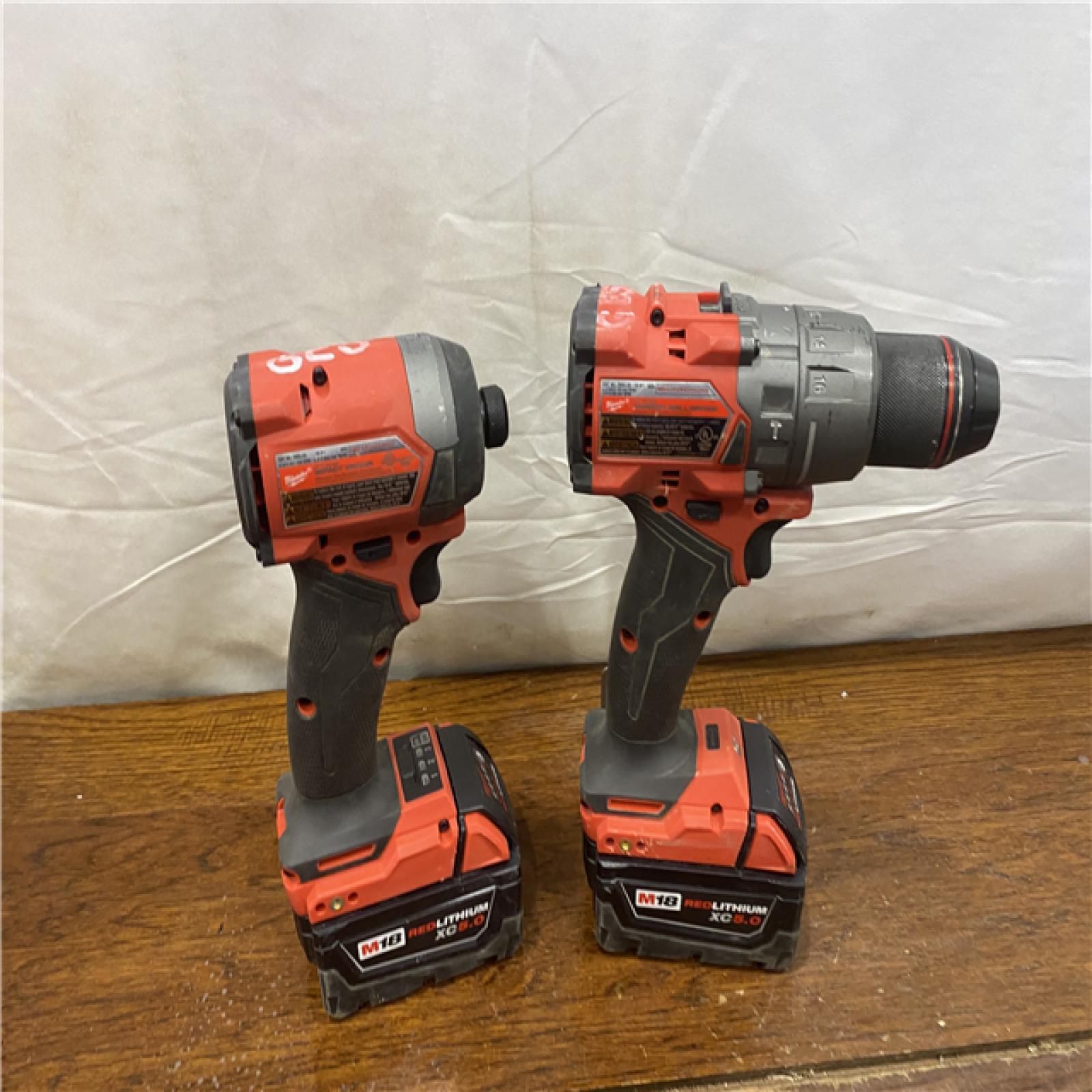 AS-IS MILWAUKEE M18 FUEL 18V Lithium-Ion Brushless Cordless Hammer Drill and Impact Driver Combo Kit (2-Tool) with 2 Batteries