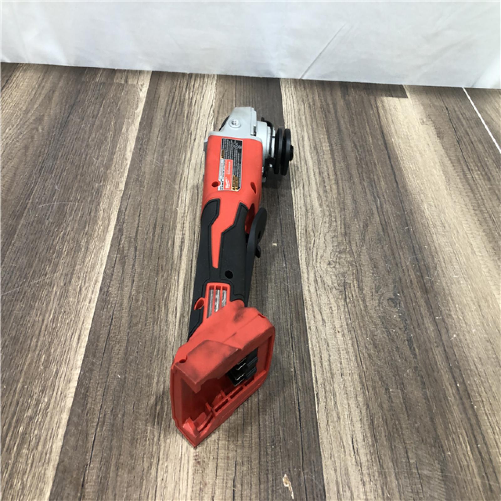 AS-IS Milwaukee 18V Lithium-Ion Brushless Cordless 4-1/2 in./5 in. Grinder w/Paddle Switch (Tool-Only)