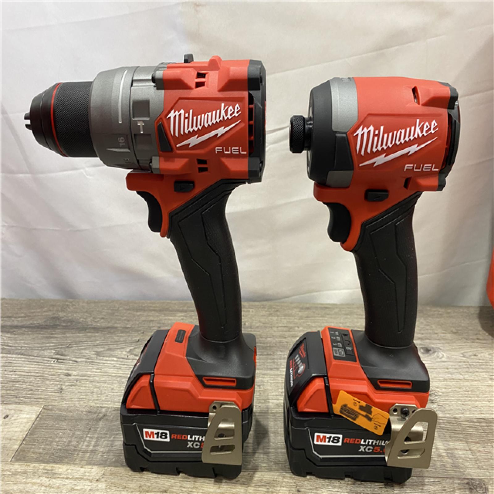 AS-IS Milwaukee FUEL 18V Lithium-Ion Brushless Cordless Hammer Drill and Impact Driver Combo Kit