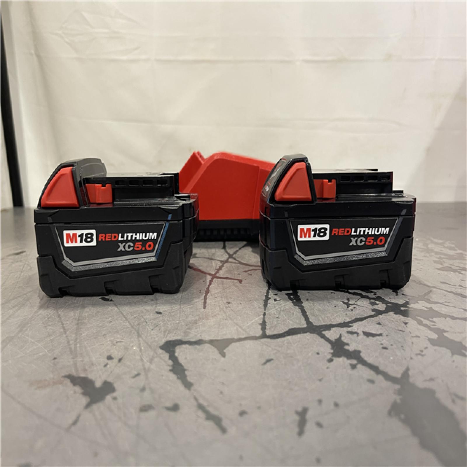 AS-IS- Milwaukee M18 18-Volt Lithium-Ion XC Starter Kit with Two 5.0Ah Batteries and Charger