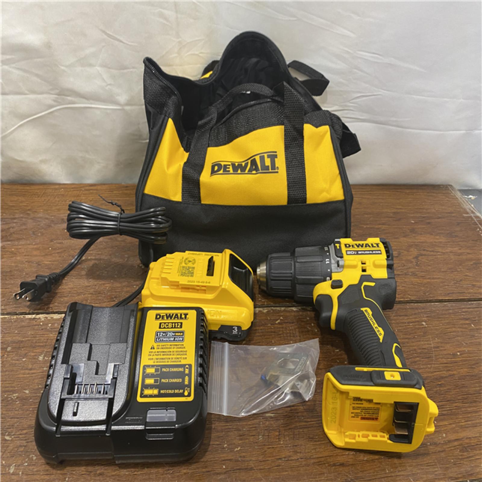AS-IS DEWALT ATOMIC 20-Volt Lithium-Ion Cordless 1/2 in. Compact Hammer Drill with 3.0Ah Battery, Charger and Bag