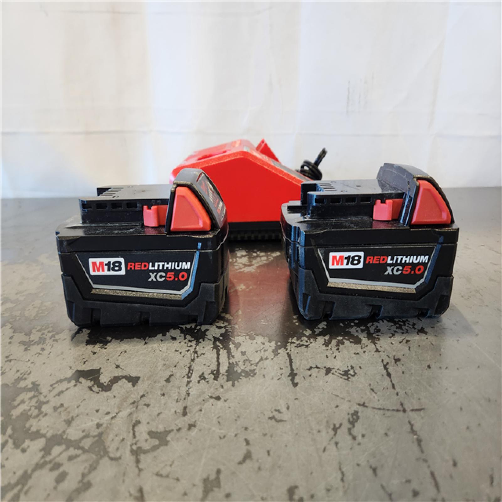 AS-IS- Milwaukee 18-Volt Lithium-Ion XC Starter Kit with Two 5.0Ah Batteries and Charger