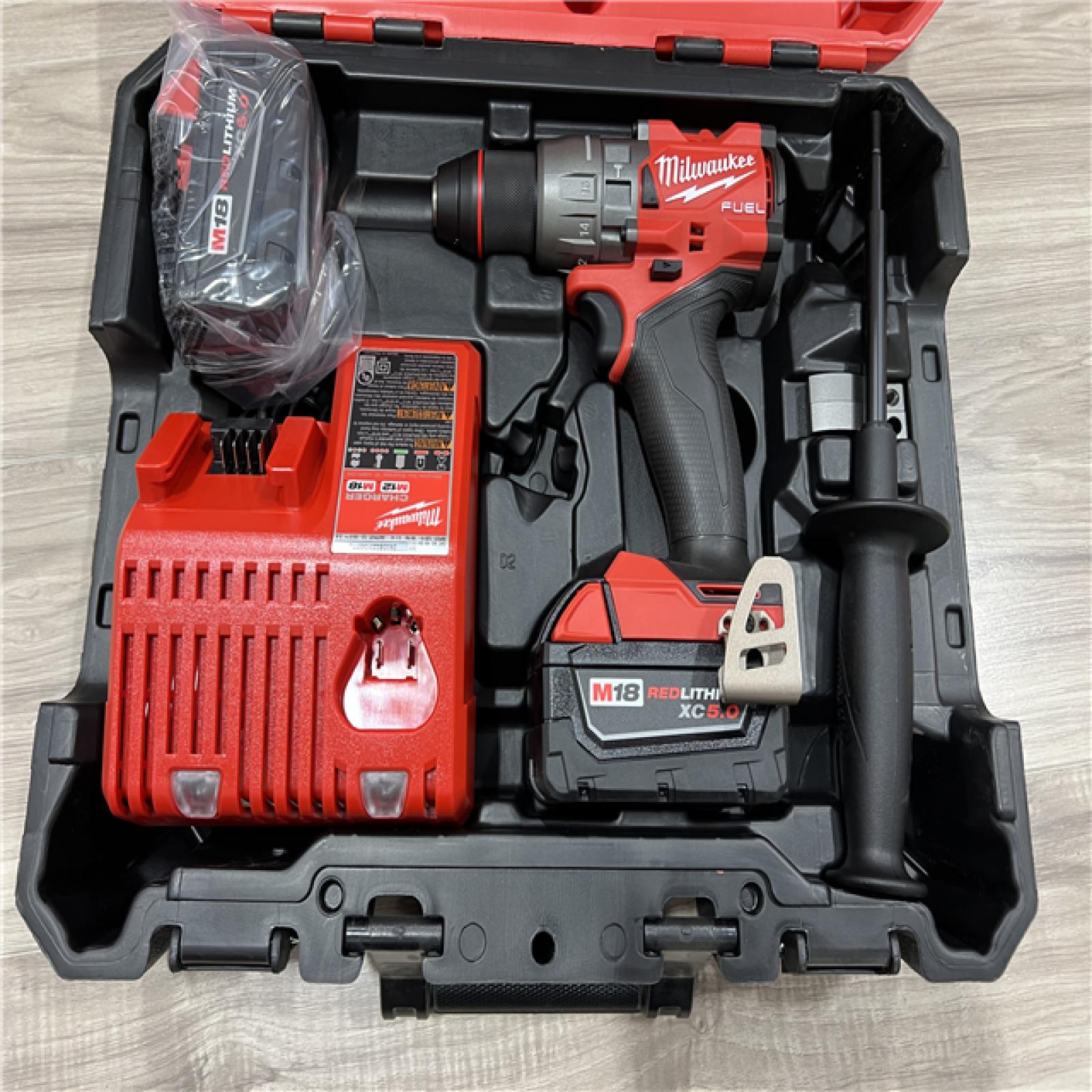 AS-IS Milwaukee FUEL 18V Lithium-Ion Brushless Cordless 1/2 in. Hammer Drill Driver Kit