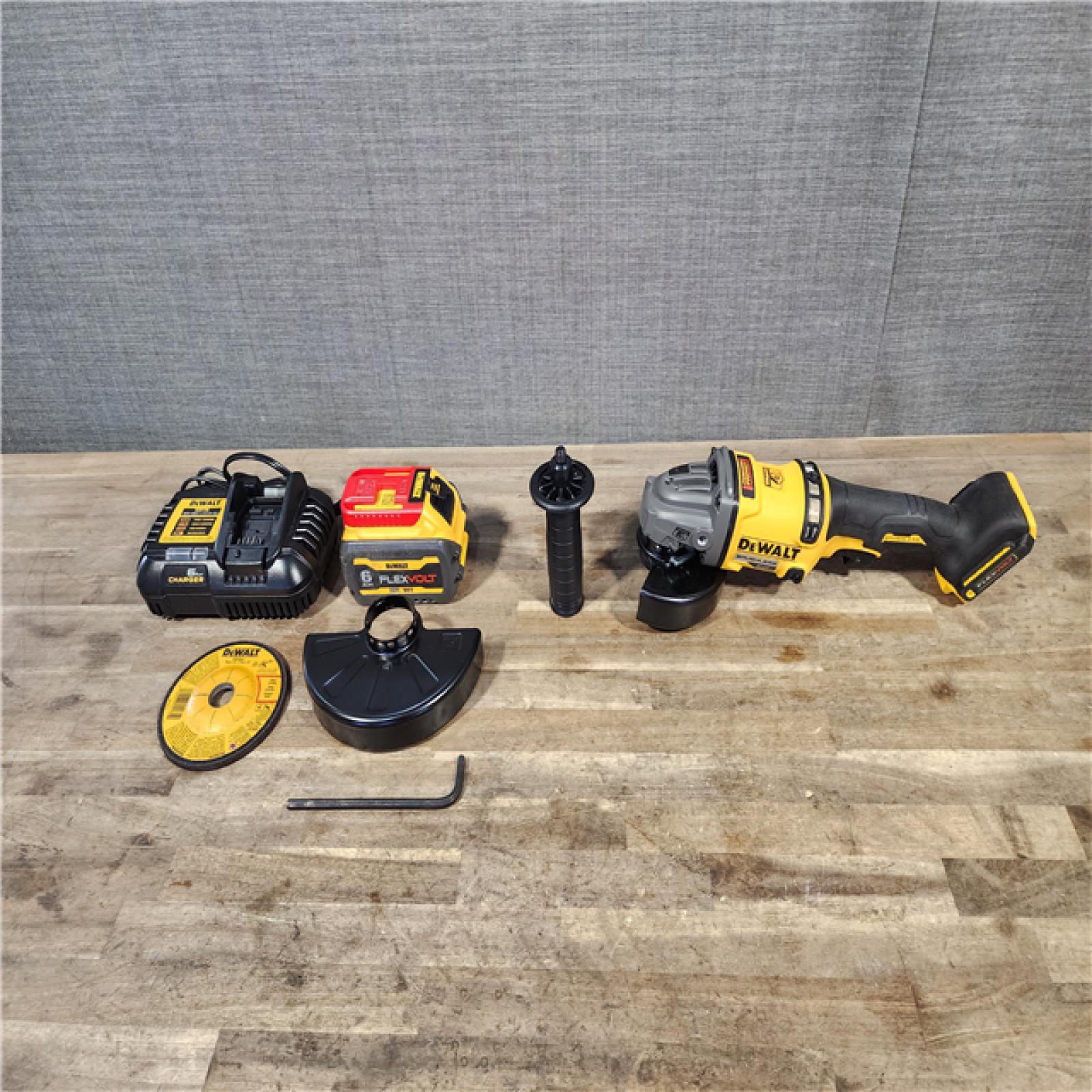 HOUSTON LOCATION - AS-IS DEWALT FLEXVOLT 60-Volt MAX Brushless 4-1/2 in. - 6 in. Cordless Grinder with Kickback Brake Kit (D) W/ BATTERY & CHARGER