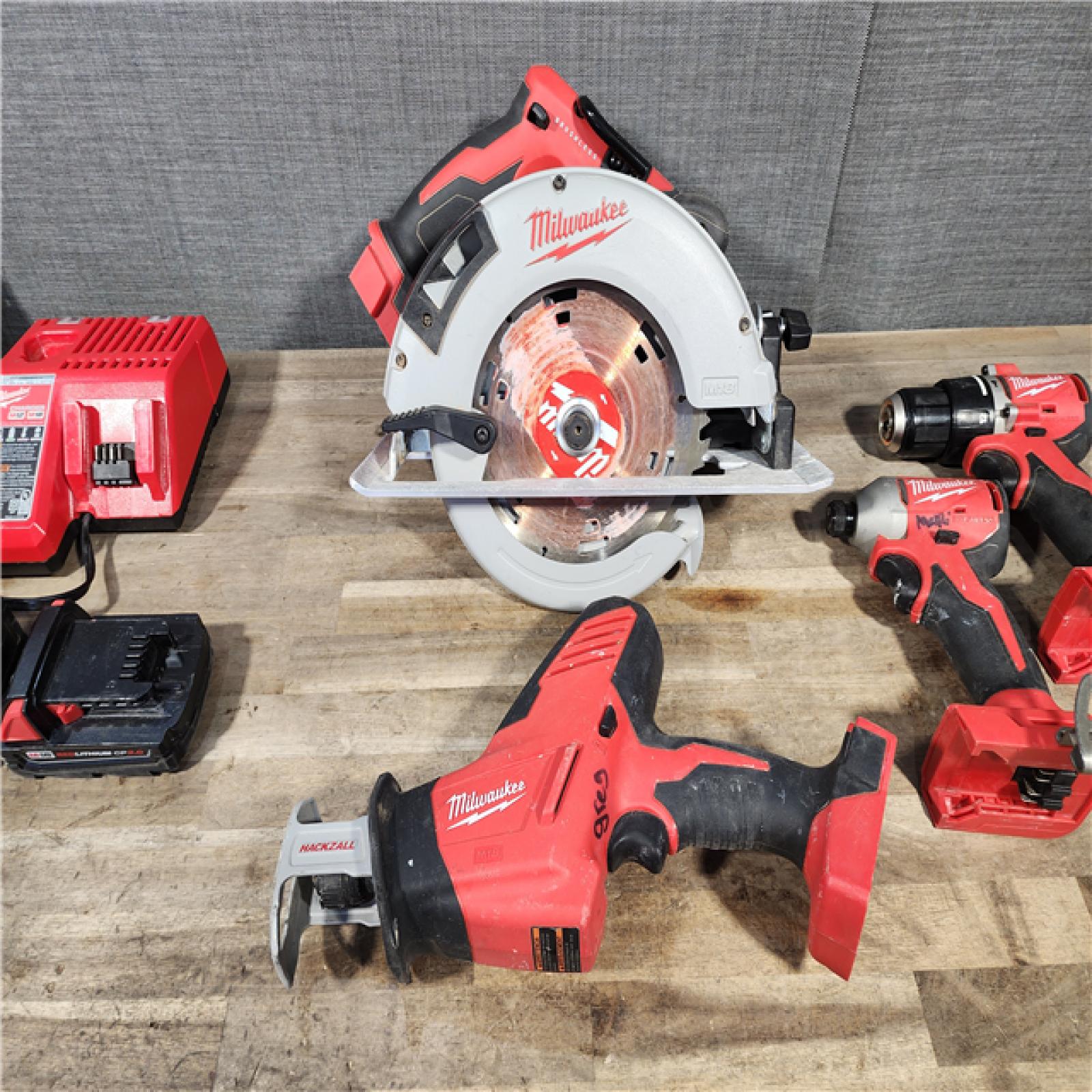 HOUSTON LOCATION - AS-IS Milwaukee M18 18-Volt Lithium-Ion Brushless Cordless Combo Kit (4-Tool) with 2-Batteries  1-Charger and Tool Bag