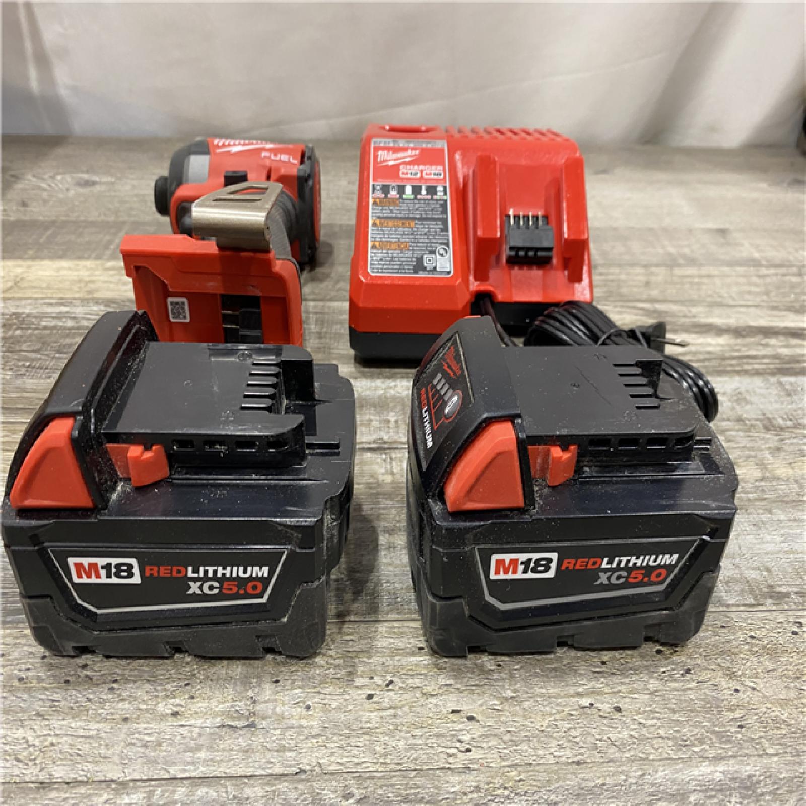 AS-IS Milwaukee FUEL 18V Lithium-Ion Brushless Cordless 1/4 in. Hex Impact Driver Kit