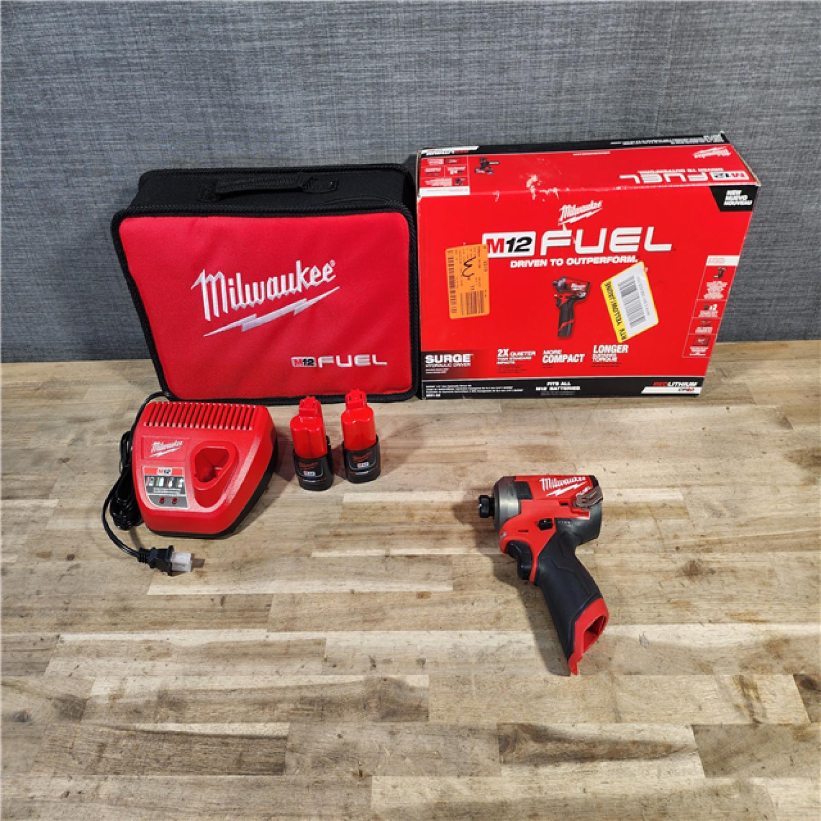 HOUSTON LOCATION - AS-IS Milwaukee M12 FUEL SURGE 12V Lithium-Ion Brushless Cordless 1/4 in. Hex Impact Driver Compact Kit W/Two 2.0Ah Batteries, Bag