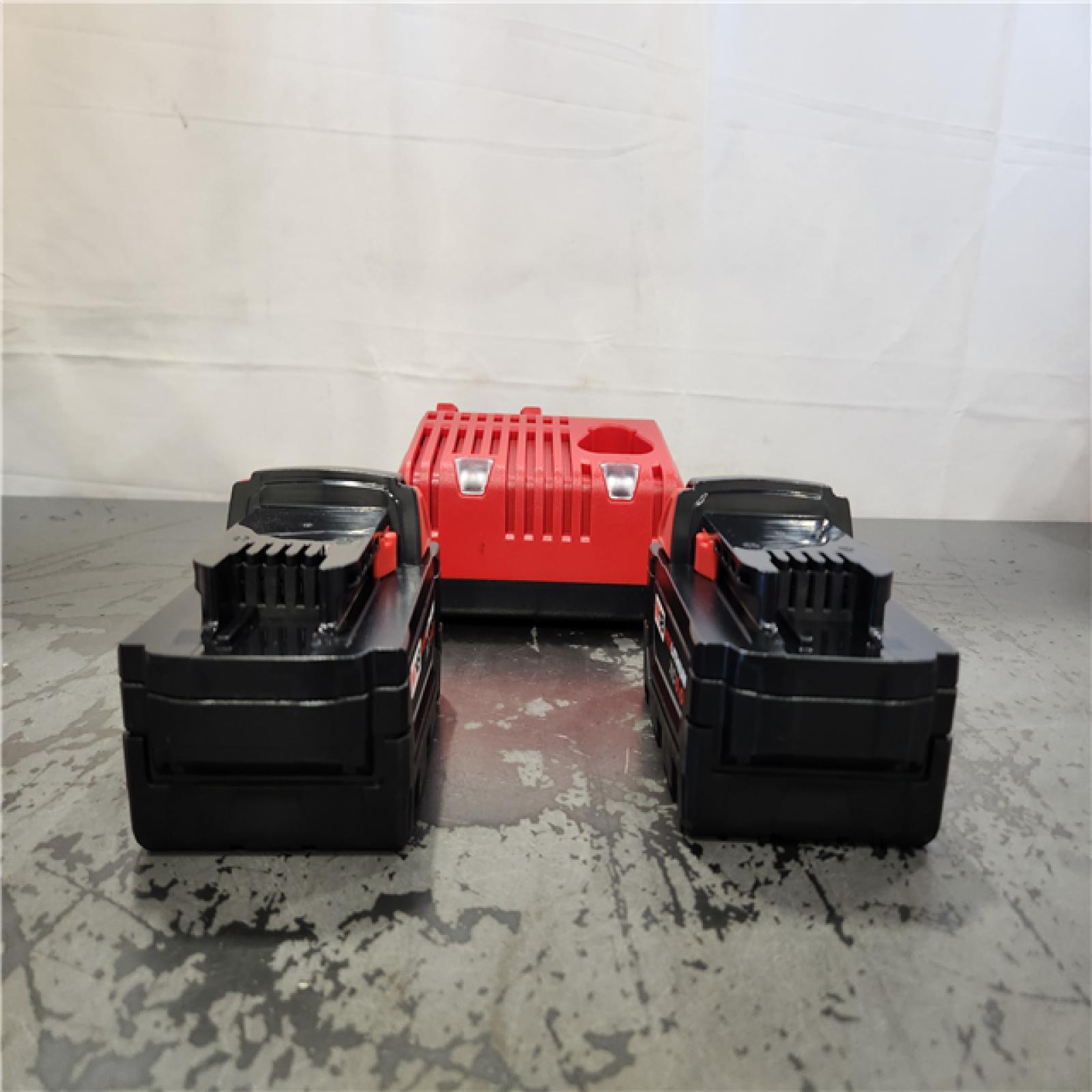 AS-IS- Milwaukee 18-Volt Lithium-Ion XC Starter Kit with Two 5.0Ah Batteries and Charger