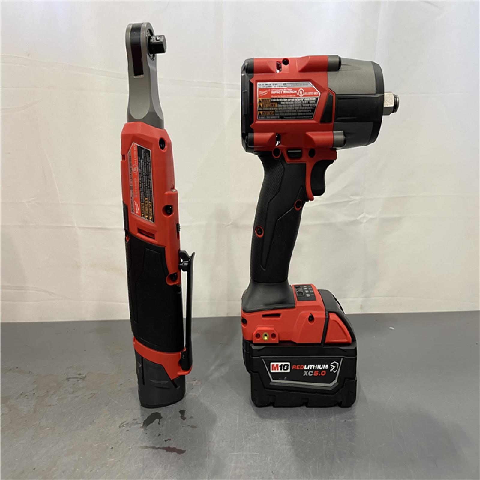 AS-IS - Milwaukee M18 FUEL 18V Cordless Mid Torque 1/2 in. Impact Wrench W/ M12 FUEL 3/8 in. Ratchet & Battery/Charger Combo Kit
