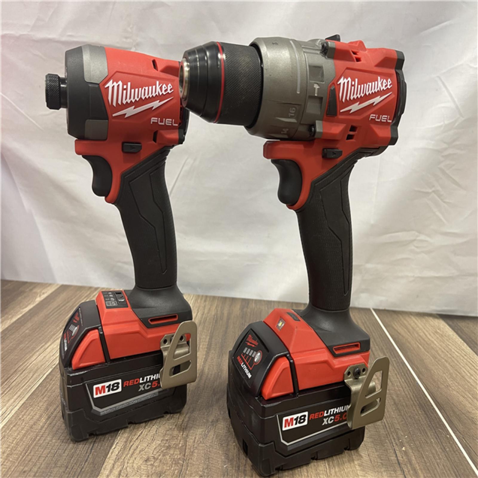 AS-IS Milwaukee FUEL 18V Lithium-Ion Brushless Cordless Hammer Drill and Impact Driver Combo Kit
