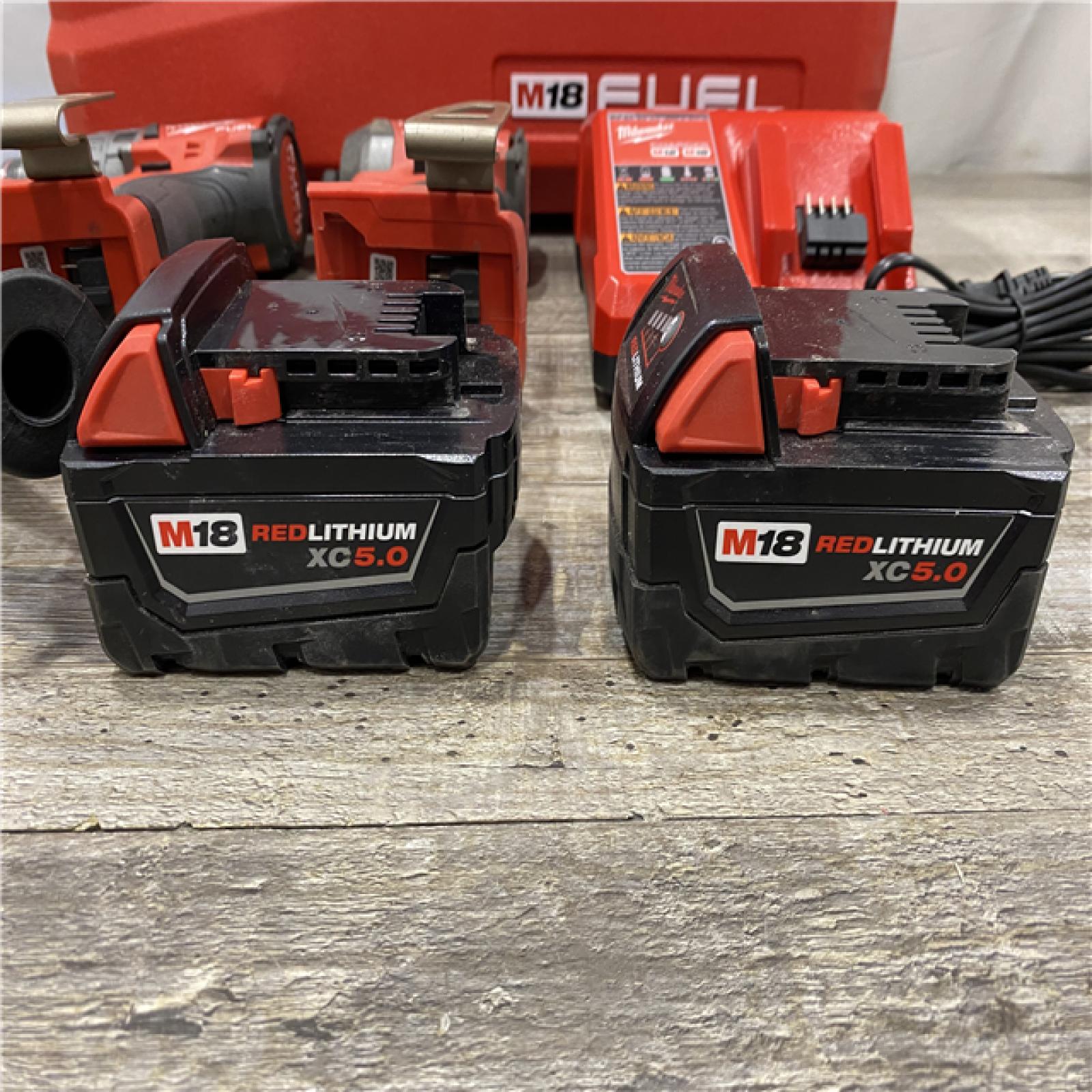 AS-IS Milwaukee FUEL 18V Lithium-Ion Brushless Cordless Hammer Drill and Impact Driver Combo Kit