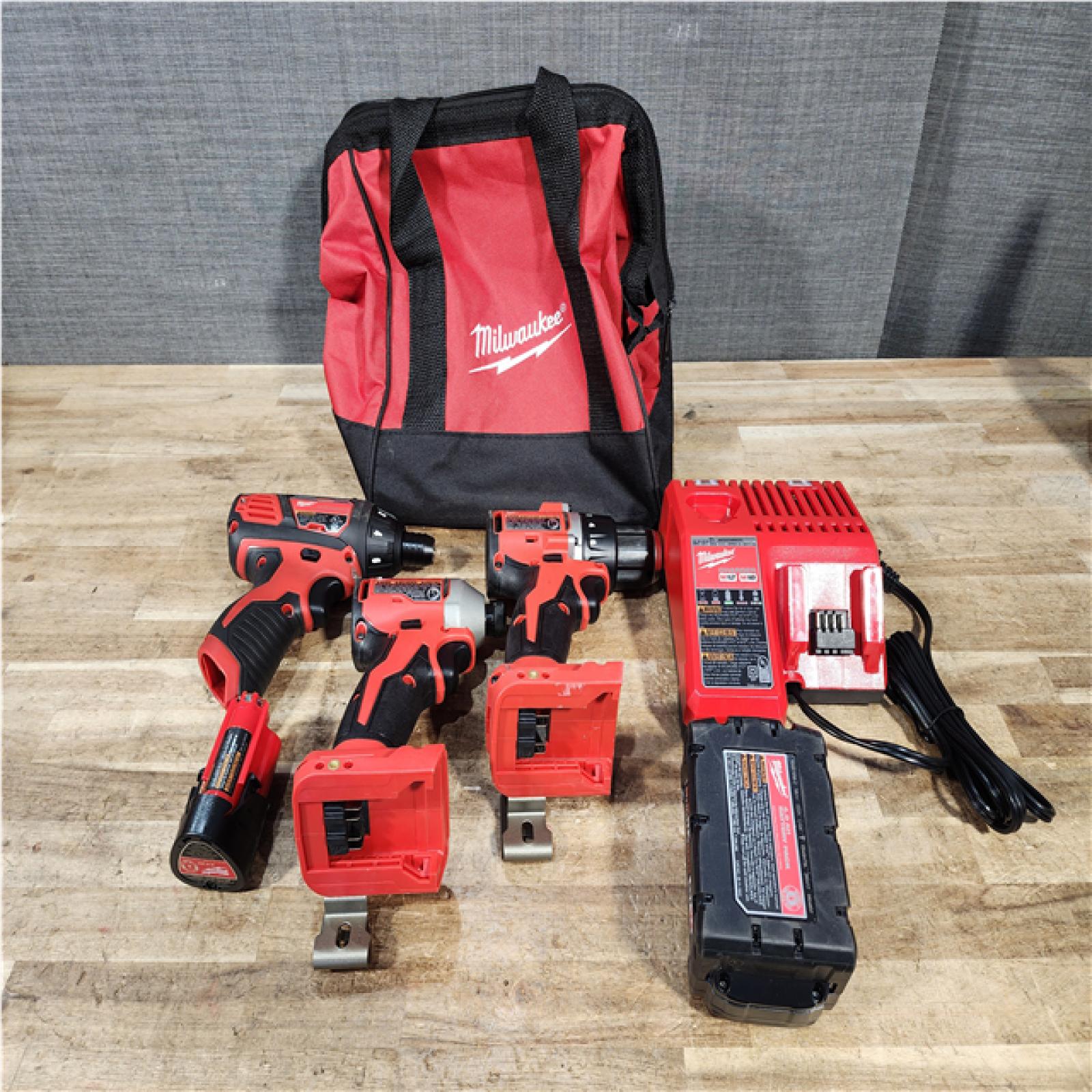 Houston Location AS-IS Milwaukee Drill and impact and Screwdriver Drill and Batteries QTY/2 and Charger