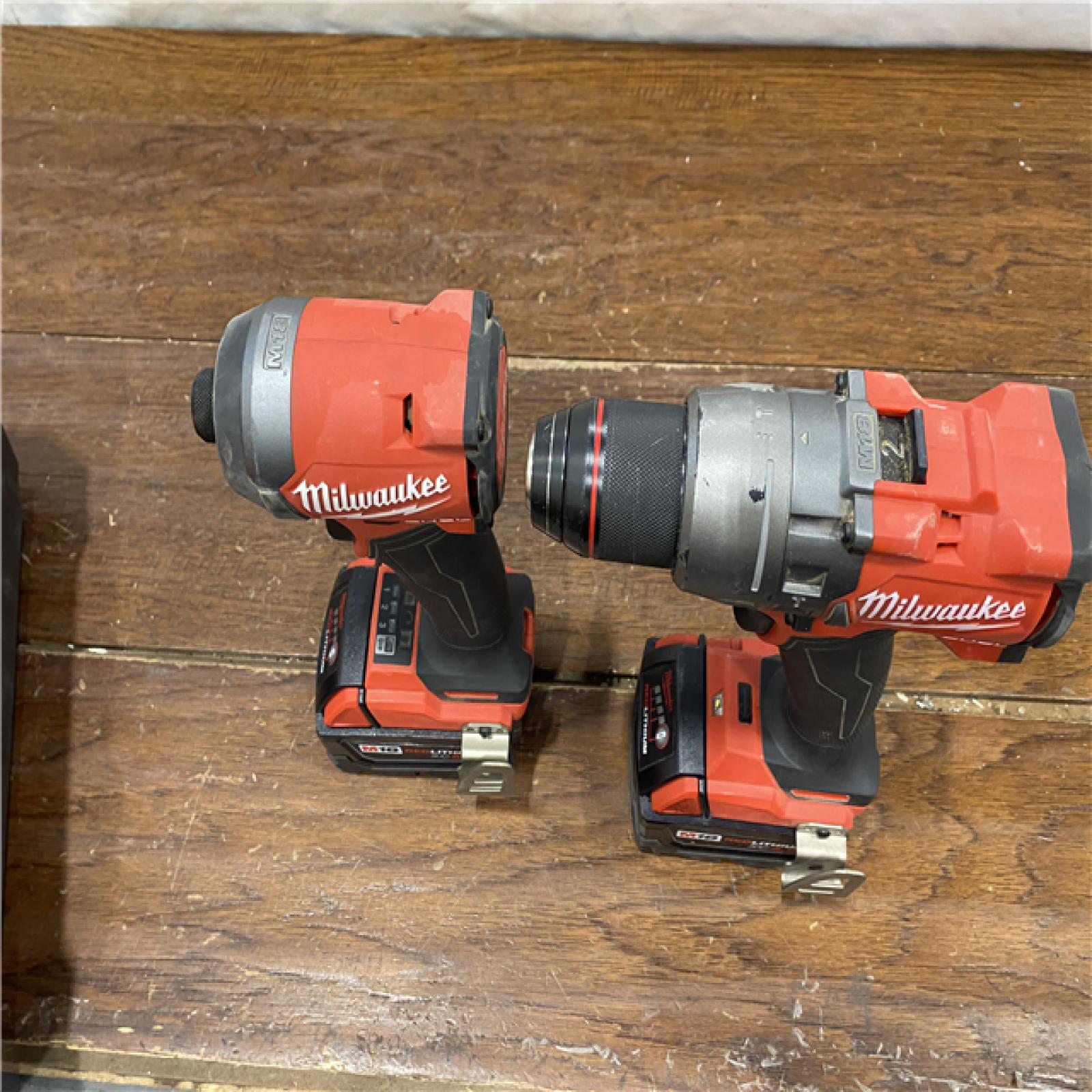 AS-IS MILWAUKEE M18 FUEL 18V Lithium-Ion Brushless Cordless Hammer Drill and Impact Driver Combo Kit (2-Tool) with 2 Batteries