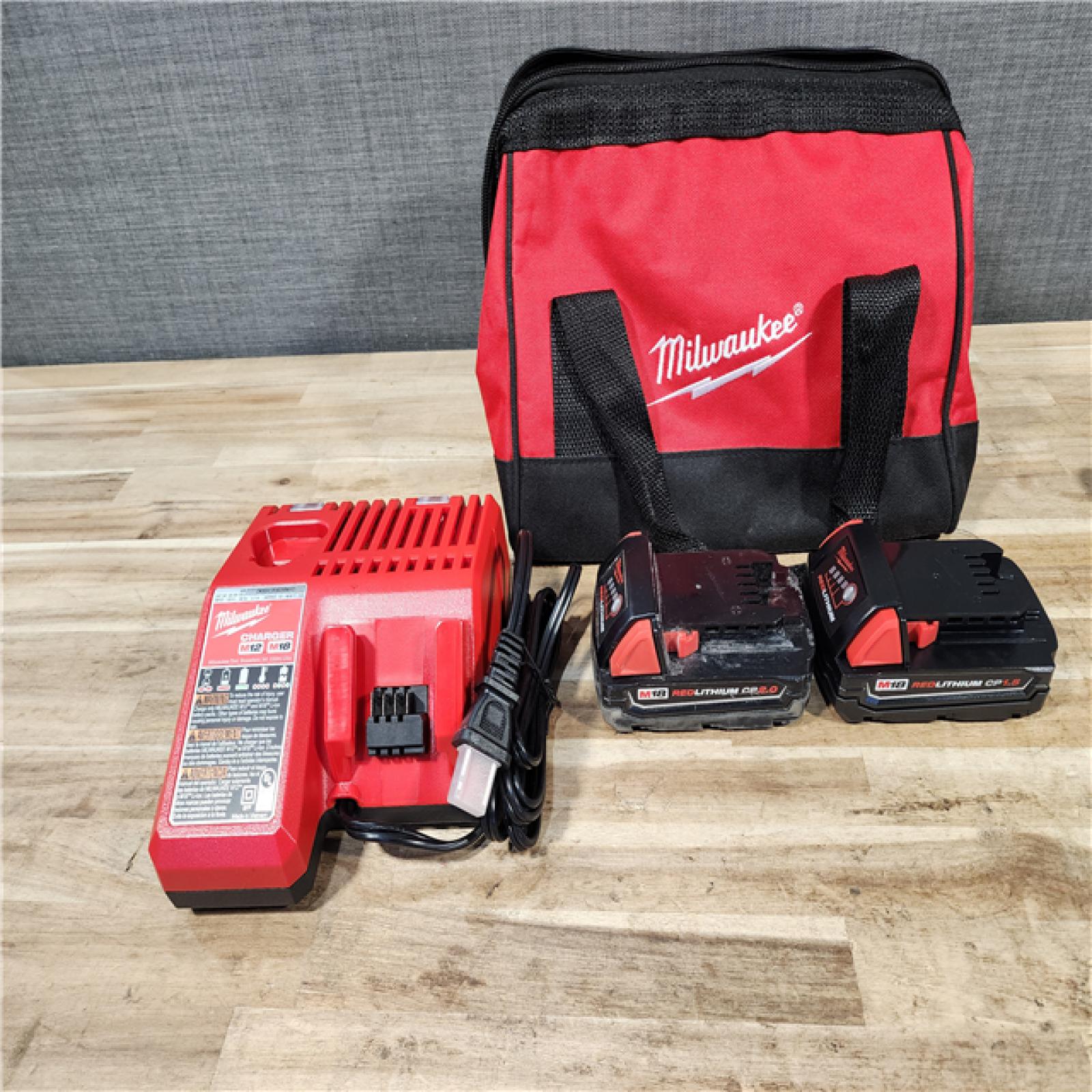 HOUSTON LOCATION - AS-IS Milwaukee 18V Lithium-Ion Cordless Drill Driver/Impact Driver Combo Kit
