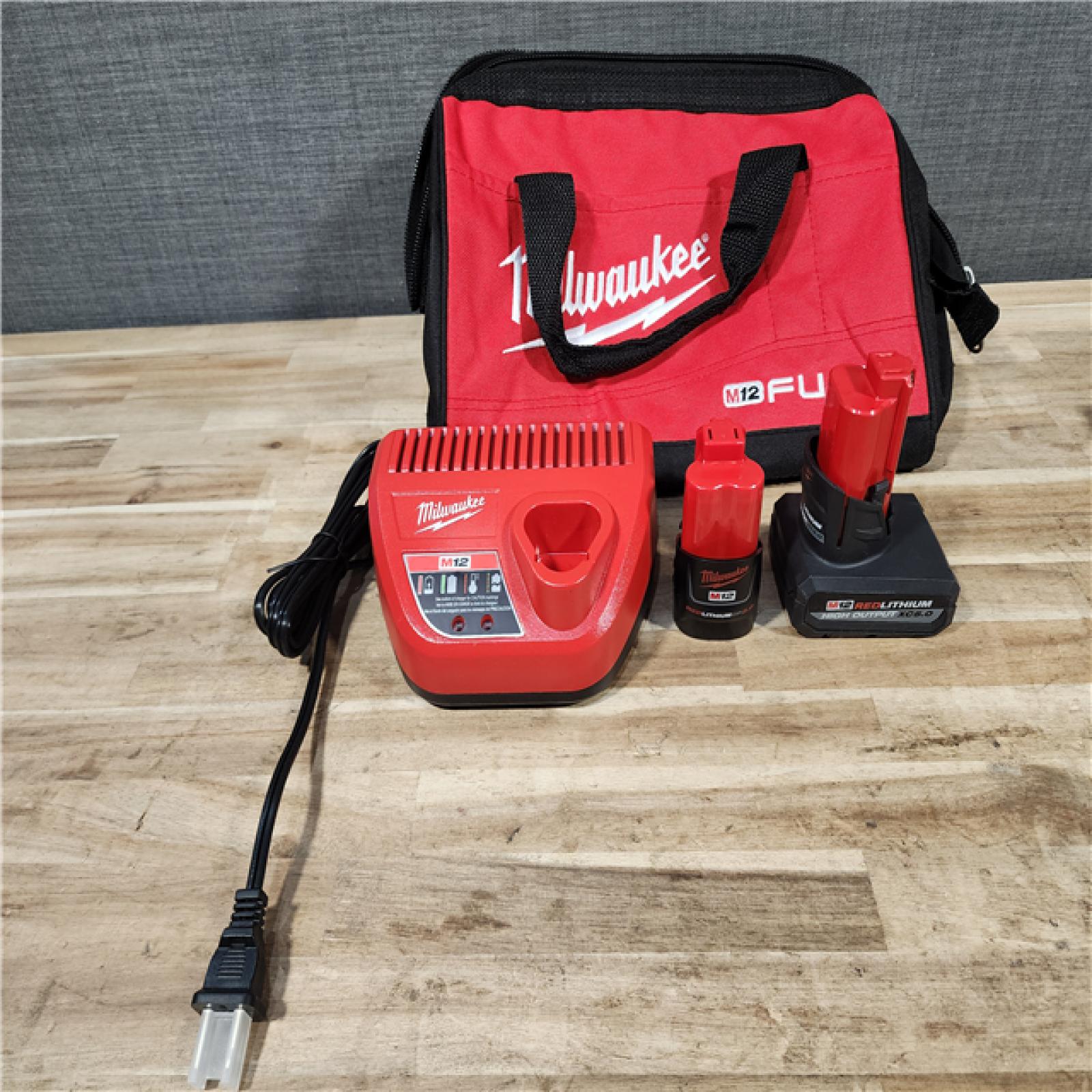 HOUSTON LOCATION - AS-IS Milwaukee FUEL 12-Volt Lithium-Ion Brushless Cordless Hammer Drill and Impact Driver Combo Kit