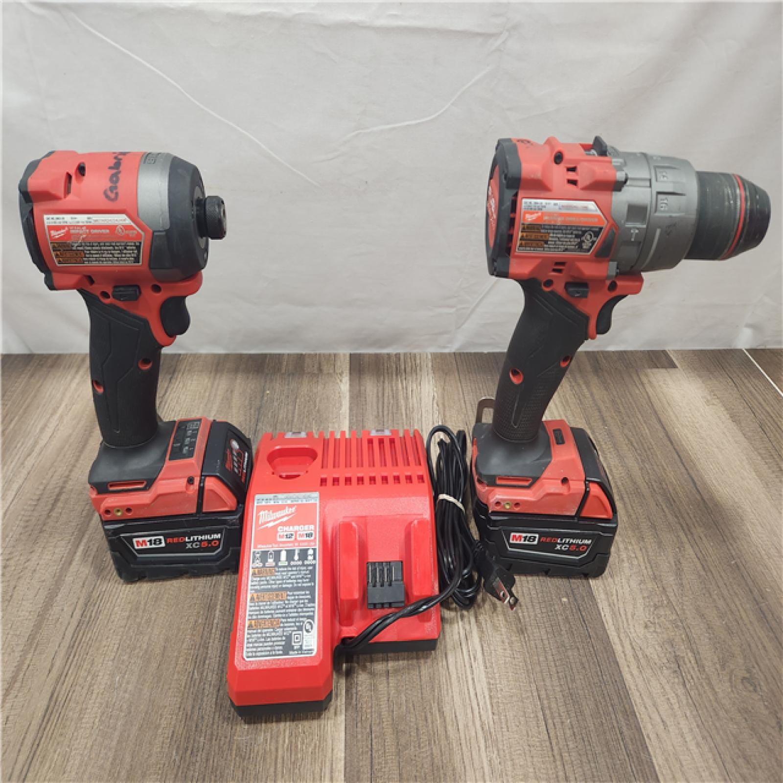 AS-IS- MILWAUKEE FUEL 18V Lithium-Ion Brushless Cordless Hammer Drill and Impact Driver Combo Kit