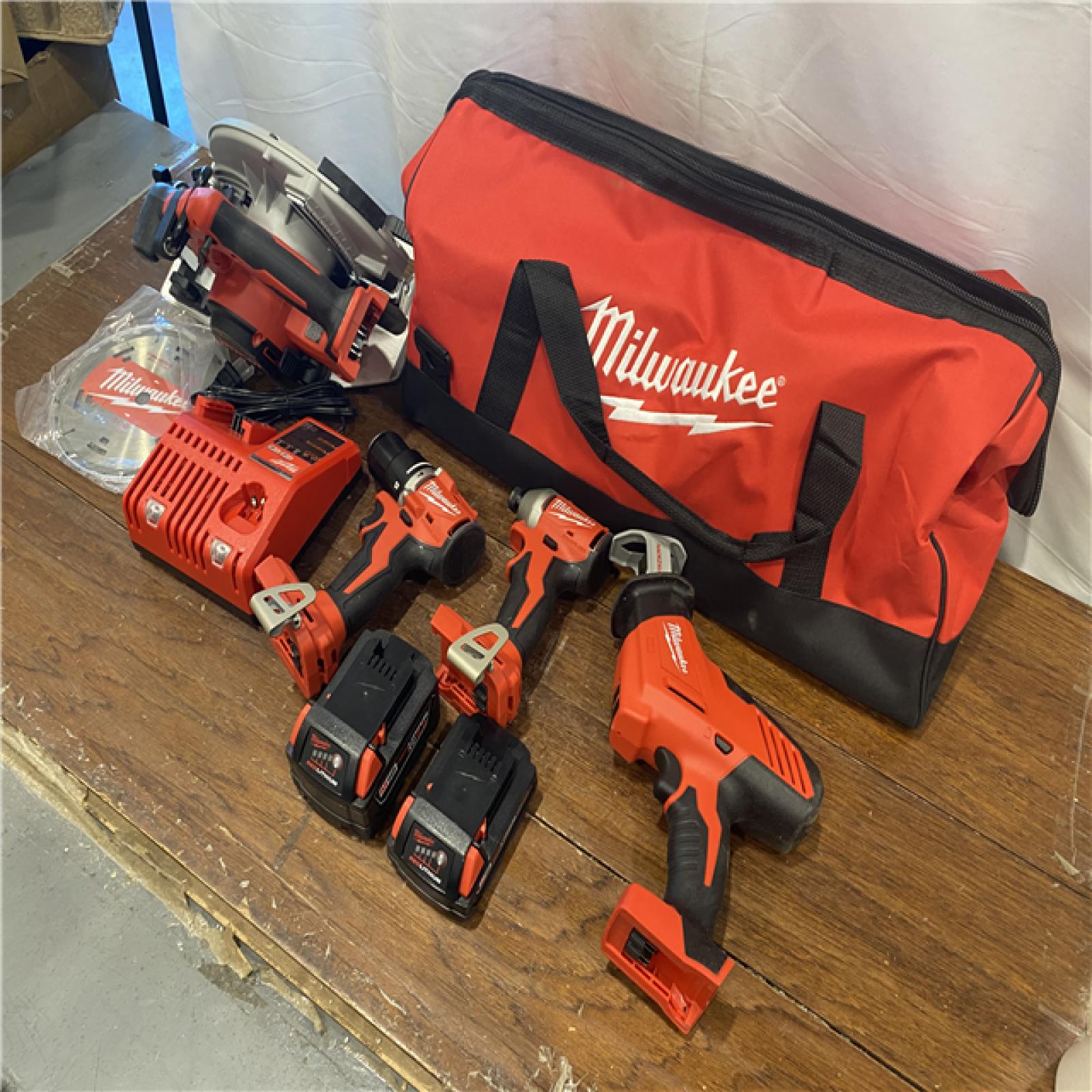 AS-IS Milwaukee M18 18-Volt Lithium-Ion Brushless Cordless Combo Kit (4-Tool) with 2-Batteries, 1-Charger and Tool Bag