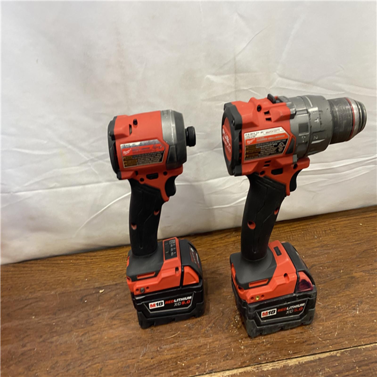 AS-IS MILWAUKEE M18 FUEL 18V Lithium-Ion Brushless Cordless Hammer Drill and Impact Driver Combo Kit (2-Tool) with 2 Batteries
