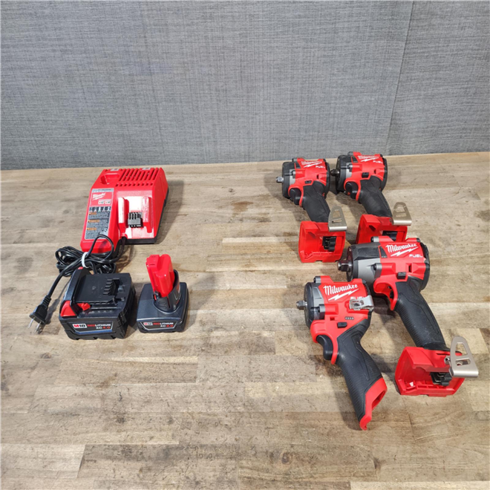 HOUSTON LOCATION - AS-IS MILWAUKEE 4 TOOL COMBO KIT W/ (2) BATTERY & CHARGER