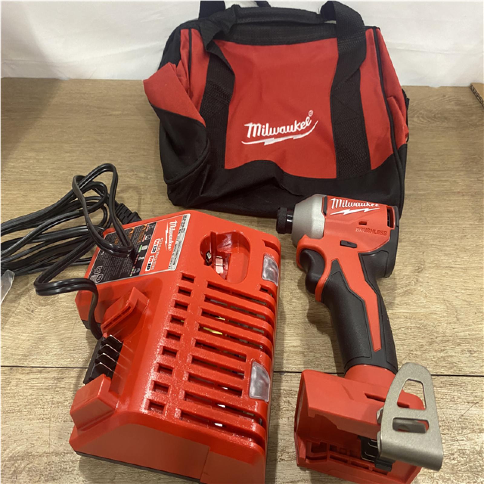 as-is Milwaukee 18V Lithium-Ion Compact Brushless Cordless 1/4 in. Impact Driver Kit