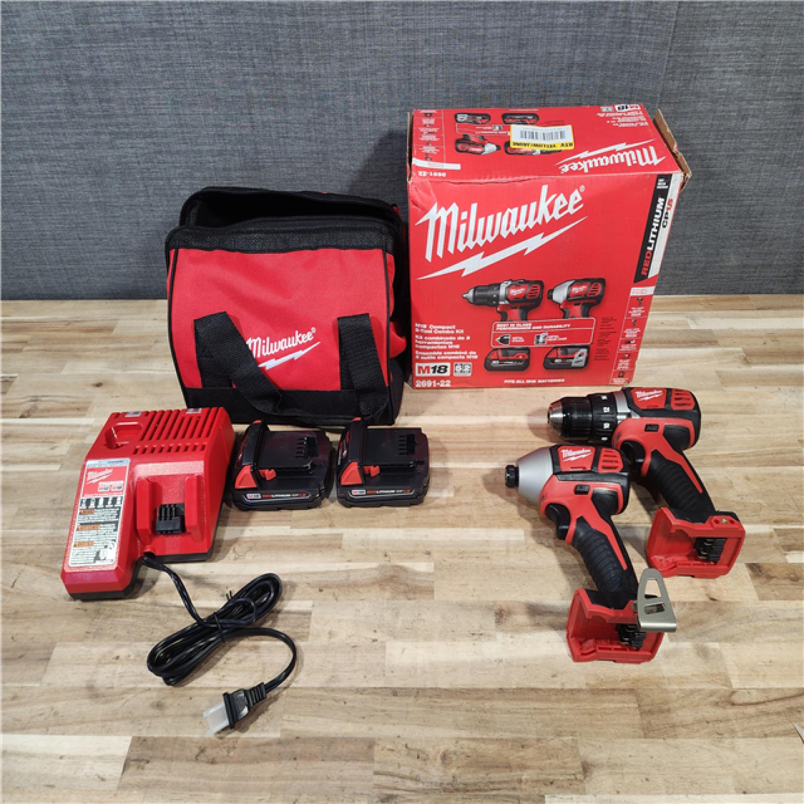 HOUSTON LOCATION - AS-IS Milwaukee 18V Lithium-Ion Cordless Drill Driver/Impact Driver Combo Kit