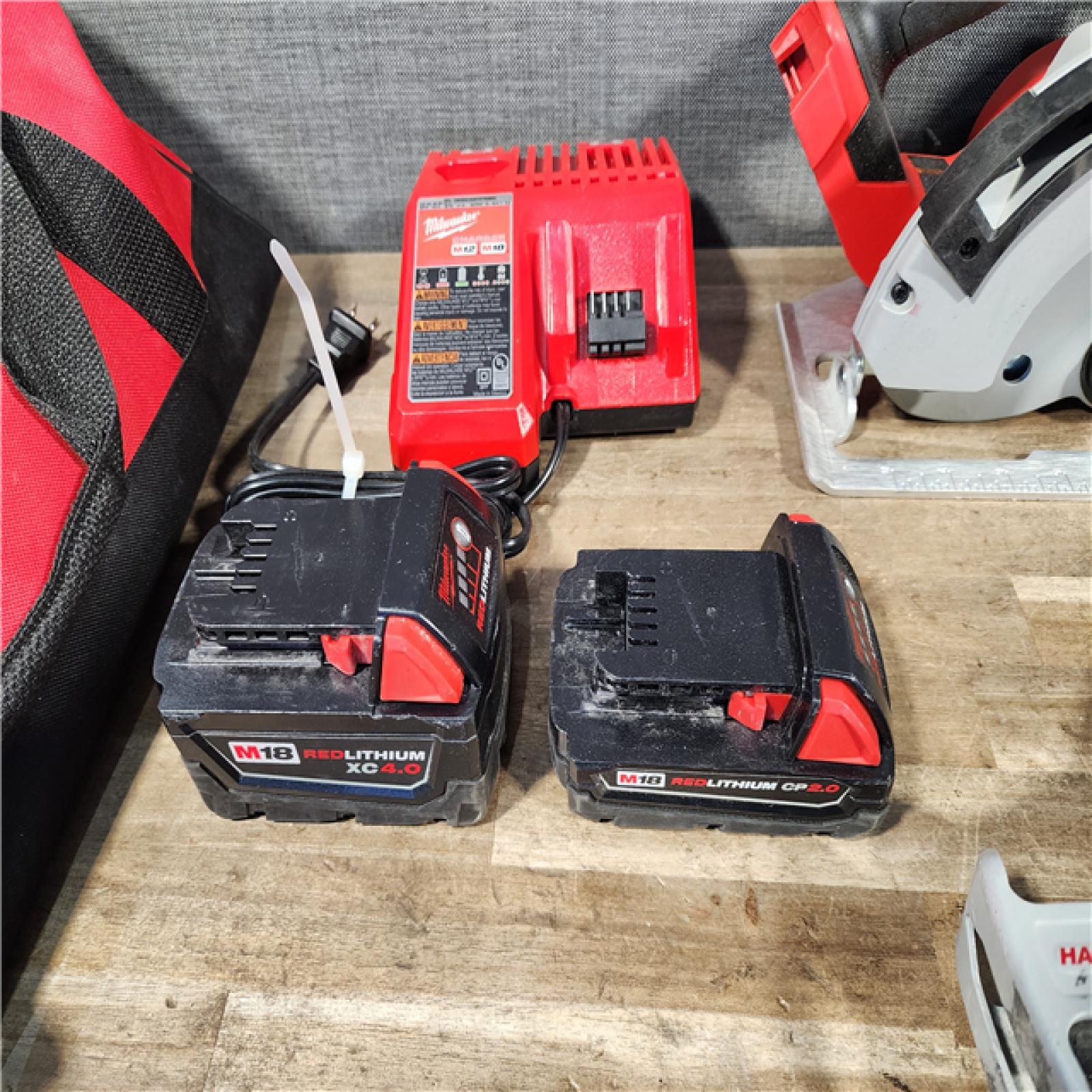 HOUSTON LOCATION - AS-IS MILWAUKEE 4 TOOL COMBO KIT W/ (2) BATTERY & CHARGER