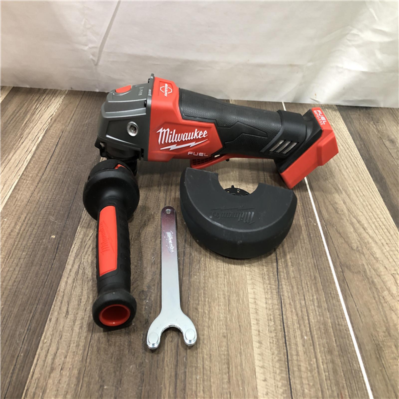AS-IS Milwaukee FUEL 18V Lithium-Ion Brushless Cordless 4-1/2 in./5 in. Grinder w/Paddle Switch (Tool-Only)
