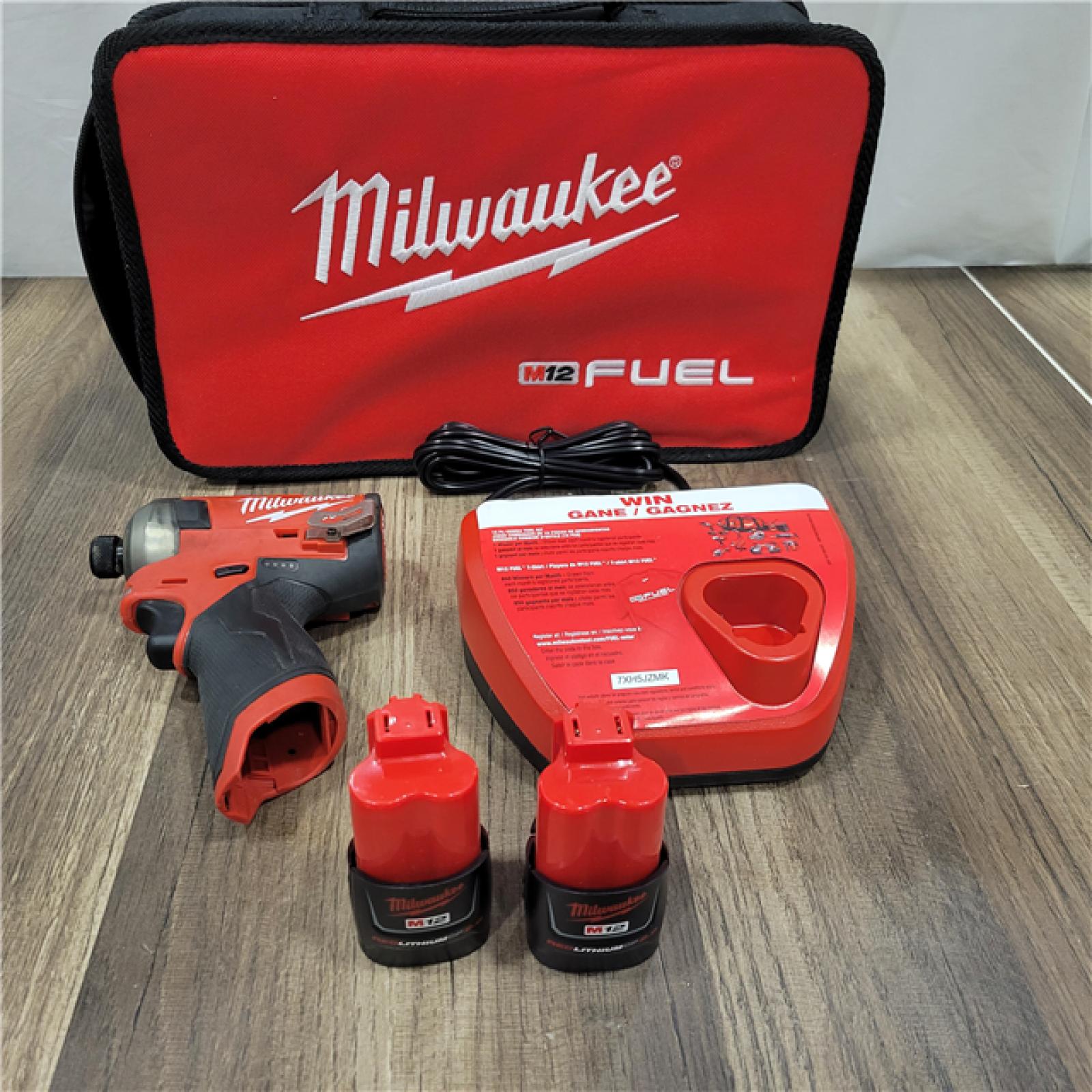 AS-IS Milwaukee M12 FUEL SURGE 12V Lithium-Ion Brushless Cordless 1/4 in. Hex Impact Driver Compact Kit W/Two 2.0Ah Batteries, Bag