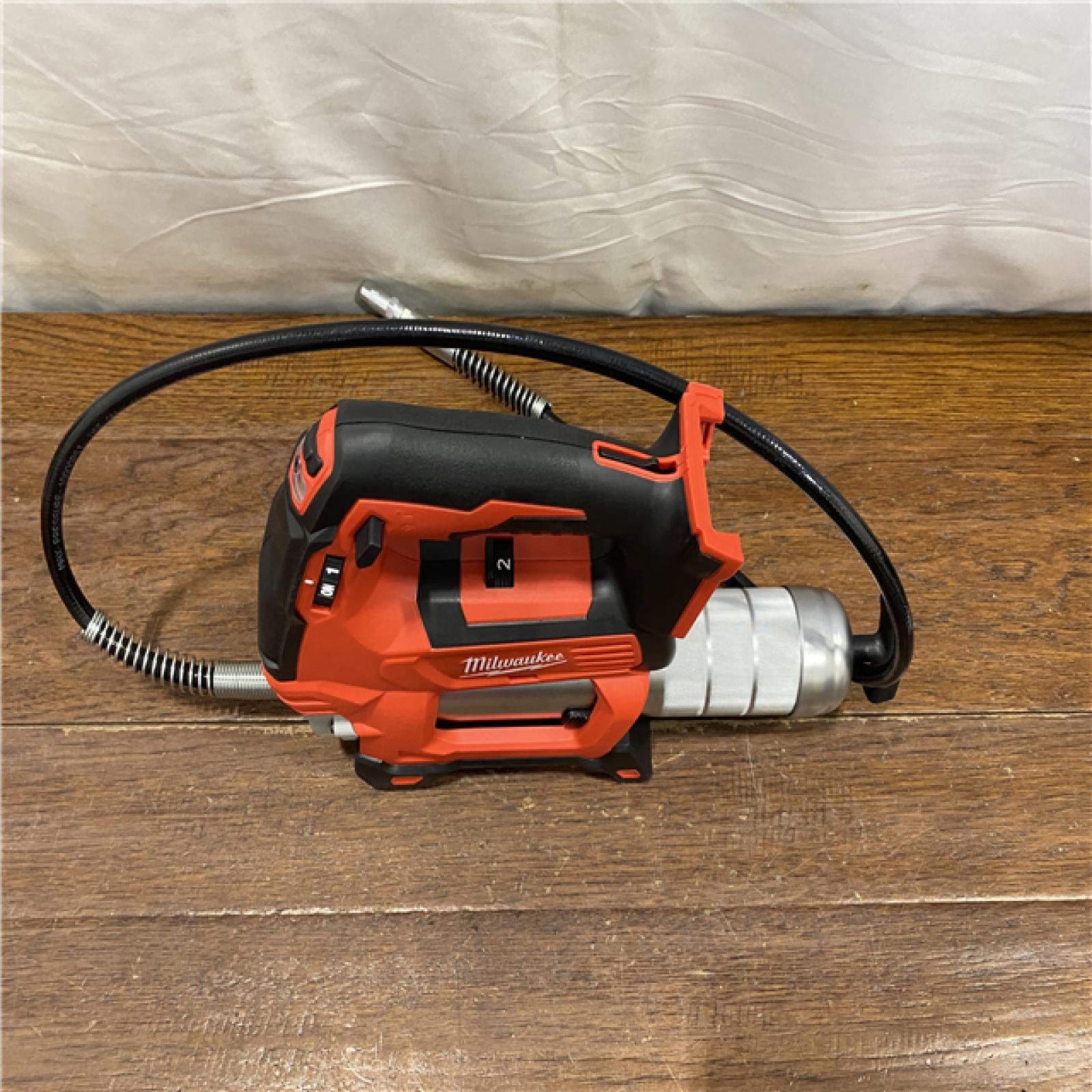 AS-IS Milwaukee Tool 10,000 PSI 14 Oz Battery-Operated Grease Gun - 48 Flexible Hose, 31 Strokes/oz | Part #2646-20