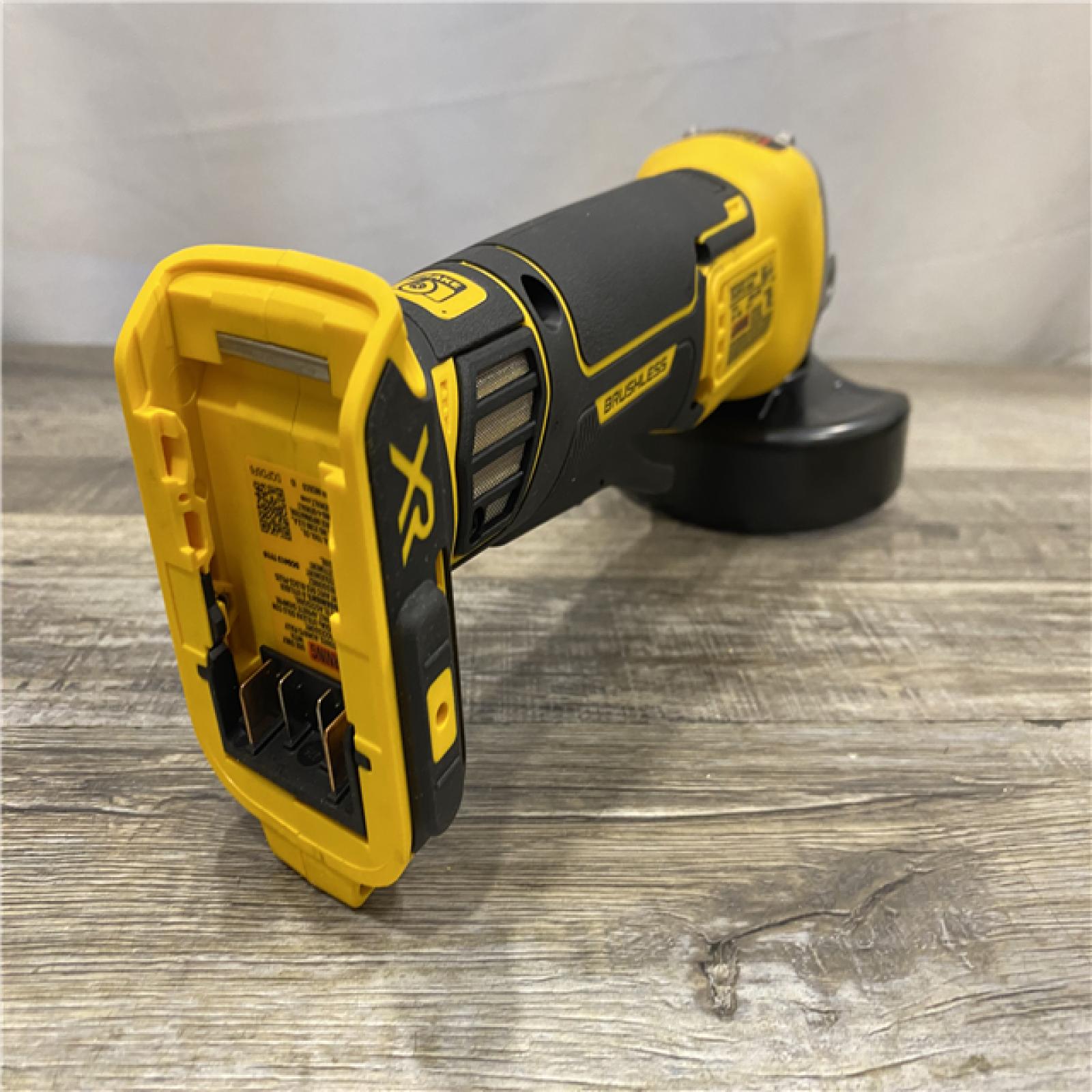 AS-IS DEWALT 20-Volt MAX XR Lithium-Ion Cordless Brushless 4-1/2 in. Paddle Switch Small Angle Grinder w/ Kickback Brake (Tool-Only)