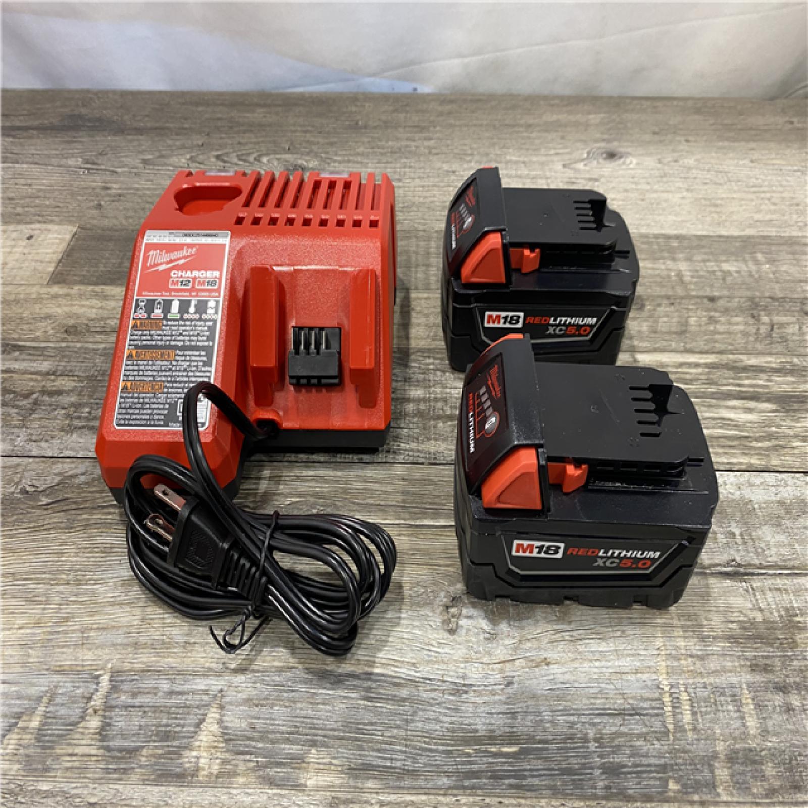 AS-IS Milwaukee 18-Volt Lithium-Ion XC Starter Kit with Two 5.0Ah Batteries and Charger
