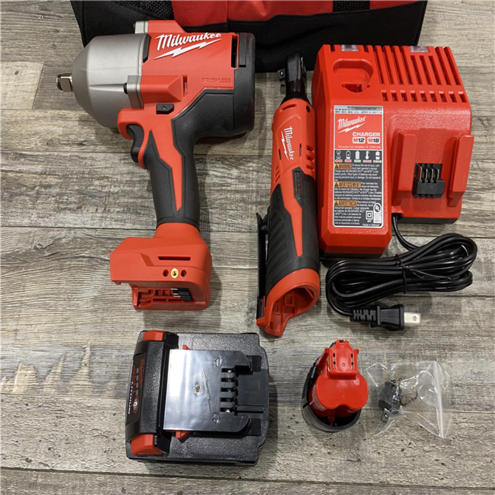AS-IS Milwaukee 12/18V Lithium-Ion Cordless 3/8 in. Ratchet and 1/2 in. High Torque Impact Wrench with Friction Ring Combo Kit