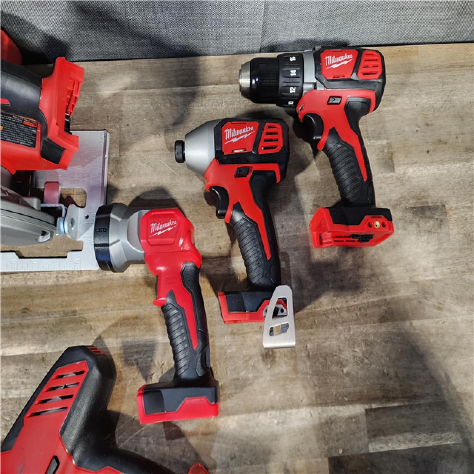 HOUSTON LOCATION - AS-IS Milwaukee M18 18-Volt Lithium-Ion Cordless Combo Tool Kit (5-Tool) with (1) 3.0Ah and (1) 1.5Ah Battery  (1) Charger  (1) Tool Bag