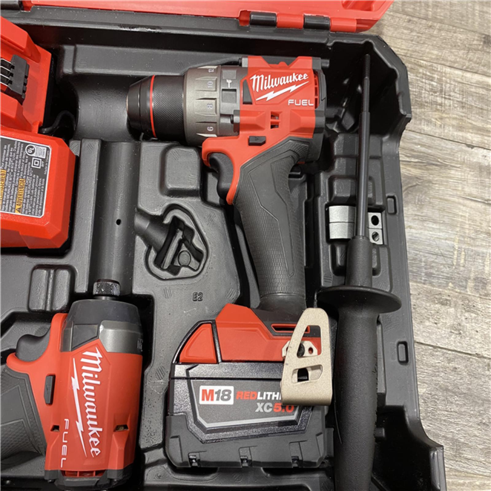 AS-IS Milwaukee FUEL 18V Lithium-Ion Brushless Cordless Hammer Drill and Impact Driver Combo Kit