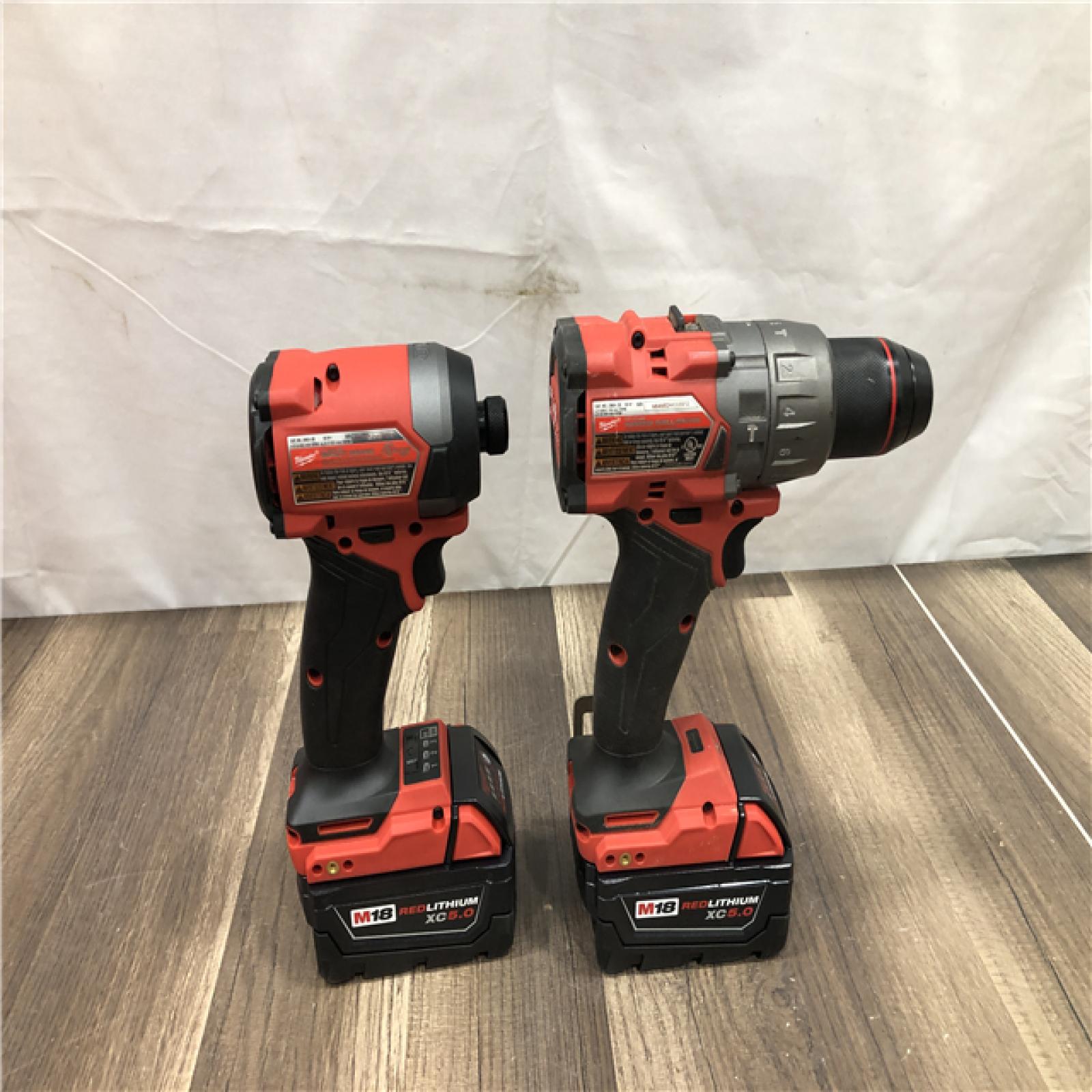 AS-IS Milwaukee FUEL 18V Lithium-Ion Brushless Cordless Hammer Drill and Impact Driver Combo Kit