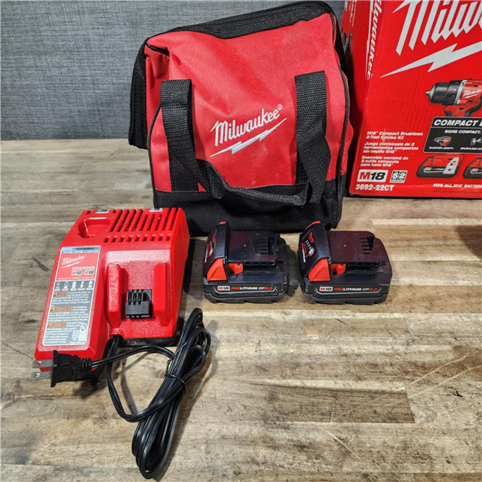 HOUSTON LOCATION - AS-IS Milwaukee M18 18V Lithium-Ion Brushless Cordless Compact Drill/Impact Combo Kit (2-Tool) W/(2) 2.0 Ah Batteries  Charger & Bag