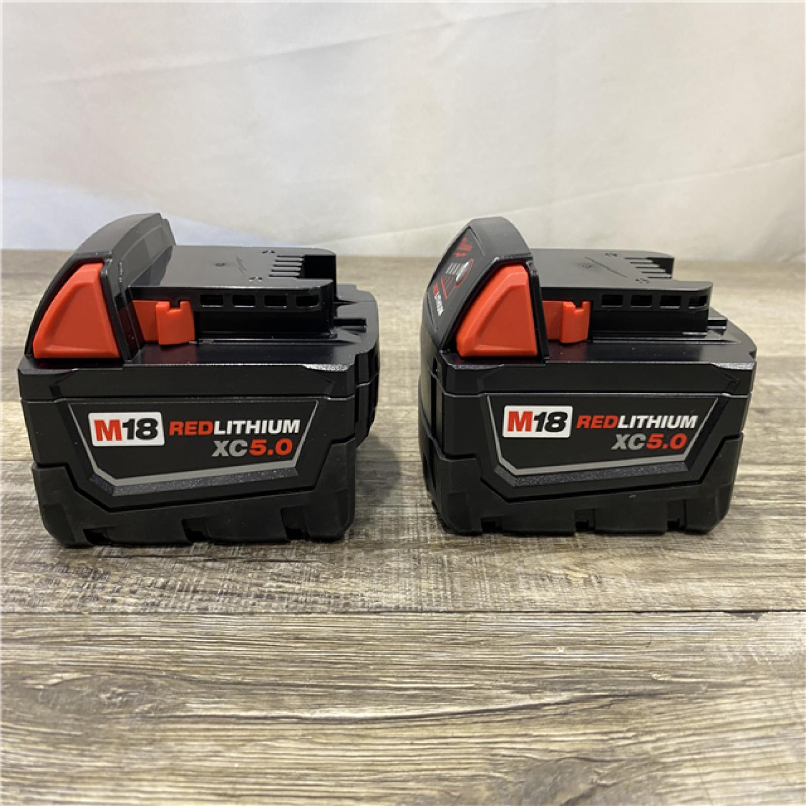 AS-IS Milwaukee FUEL SURGE 18V Lithium-Ion Brushless Cordless 1/4 in. Hex Impact Driver with (2) 5.0 Ah Battery and Charger