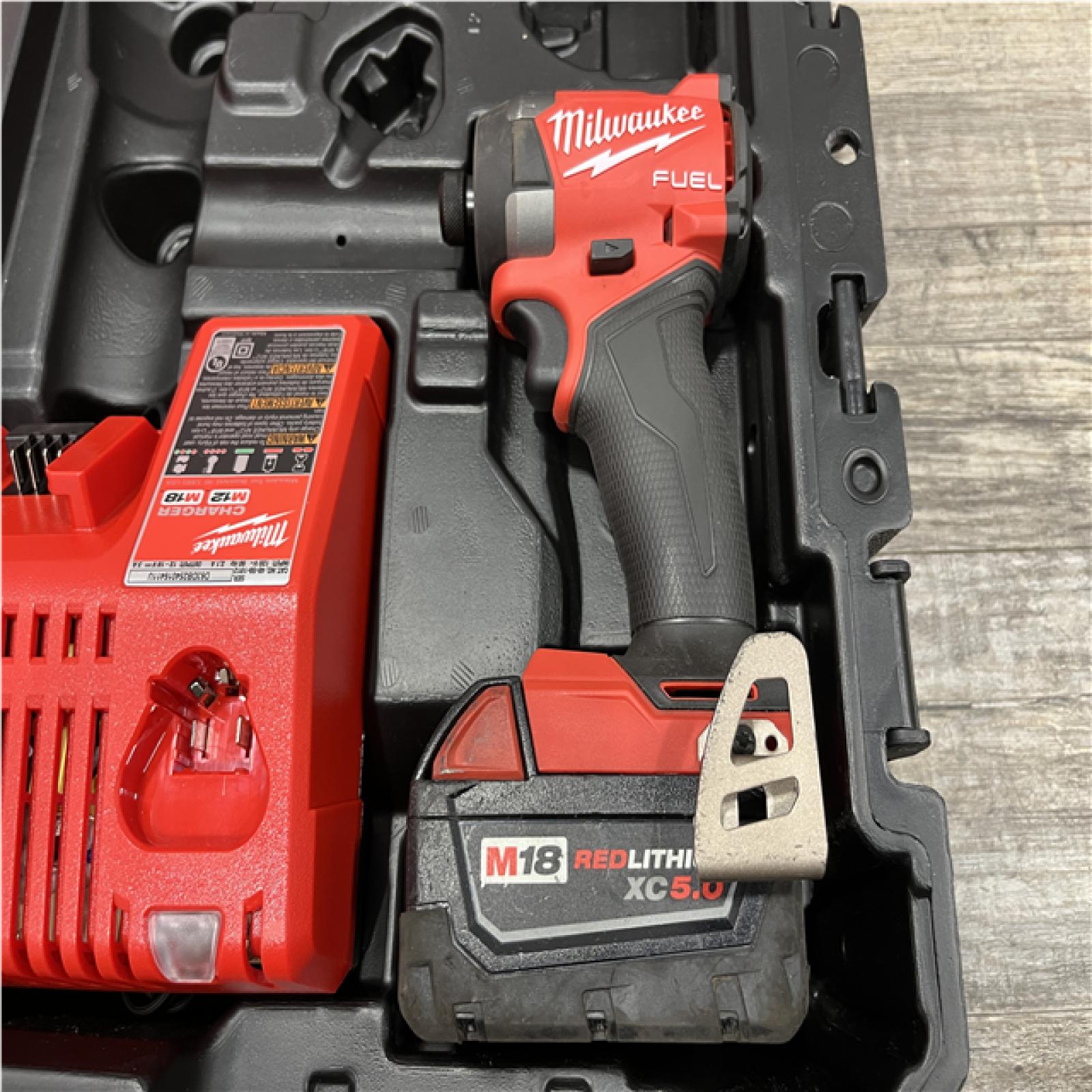 AS-IS Milwaukee FUEL 18V Lithium-Ion Brushless Cordless Hammer Drill and Impact Driver Combo Kit