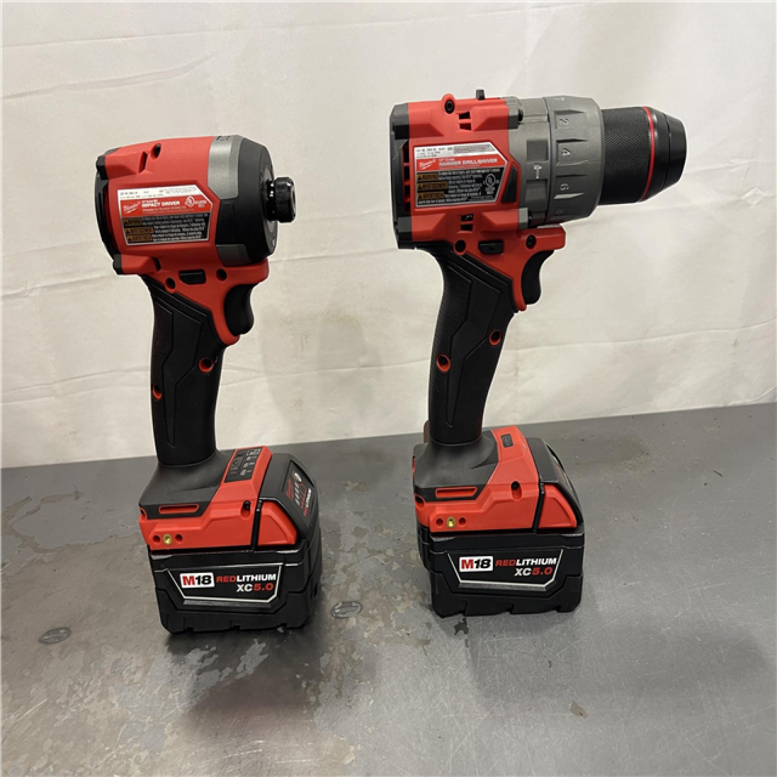 AS-IS - Milwaukee M18 FUEL 18V Lithium-Ion Brushless Cordless Hammer Drill and Impact Driver Combo Kit (2-Tool) with 2 Batteries
