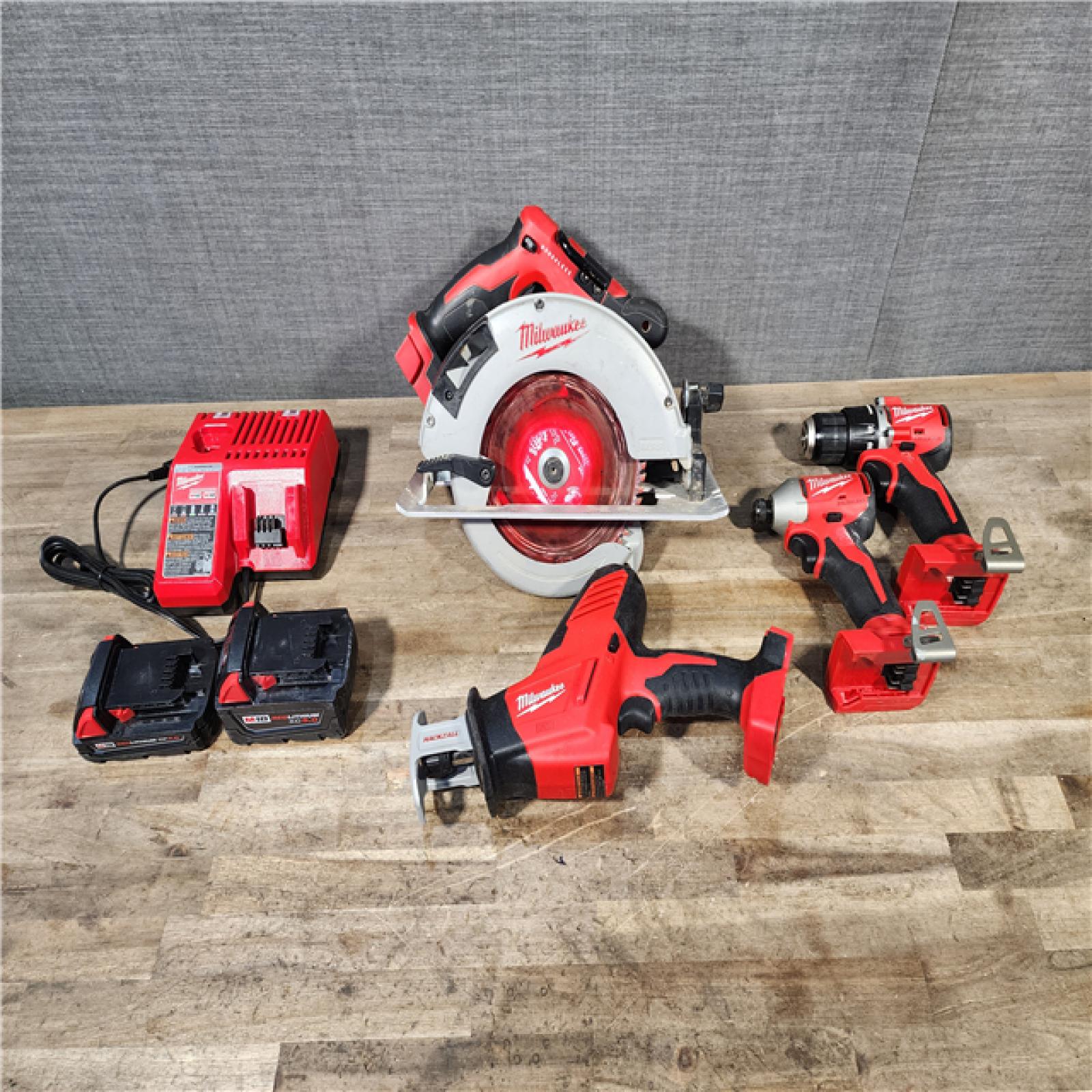 HOUSTON LOCATION - AS-IS Milwaukee M18 18-Volt Lithium-Ion Brushless Cordless Combo Kit (4-Tool) with 2-Batteries  1-Charger