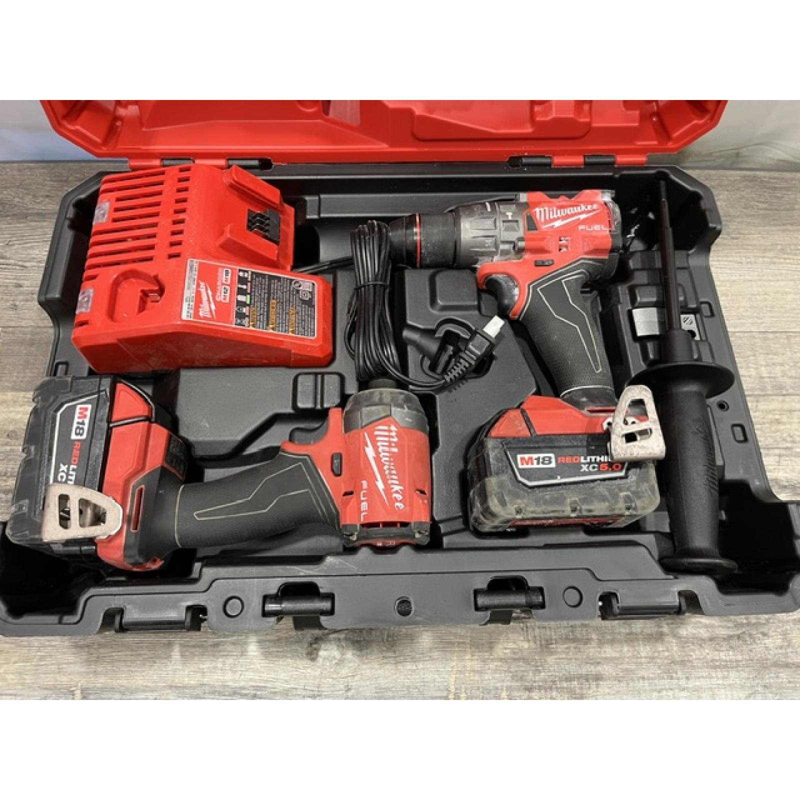 AS-IS Milwaukee FUEL 18V Lithium-Ion Brushless Cordless Hammer Drill and Impact Driver Combo Kit