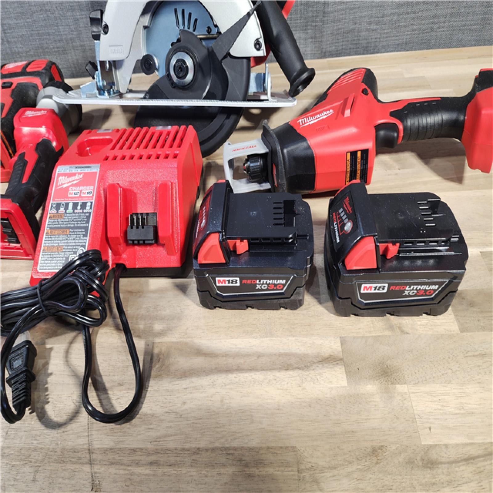 HOUSTON LOCATION - AS-IS (APPEARS LIKE NEW) Milwaukee M18 18-Volt Lithium-Ion Cordless Combo Kit 7-Tool with 2-Batteries, Charger and Tool Bag